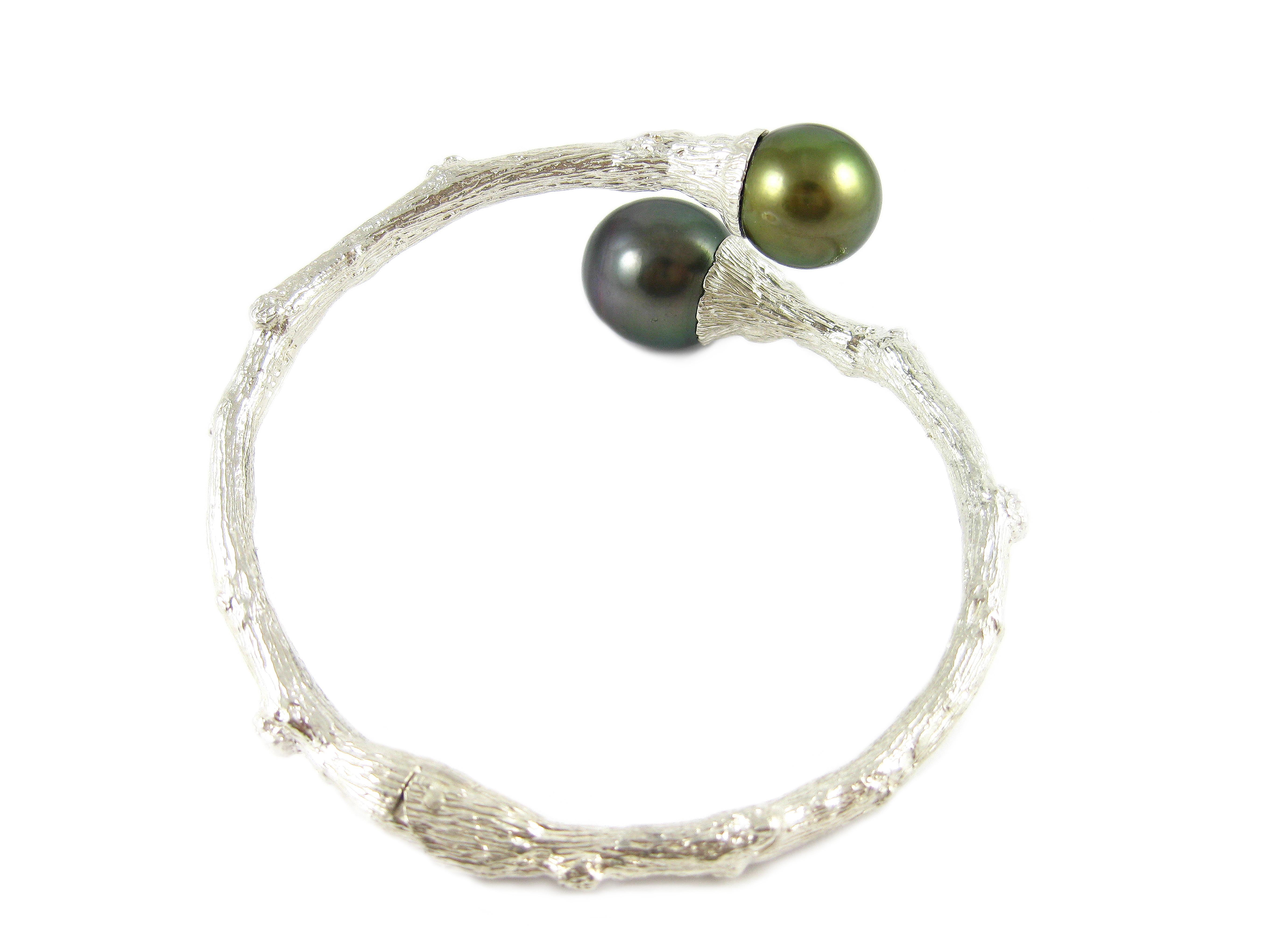 Channeling the eternal Tree of Life, the organic spirit of K. Brunini is captured through this delicate handcrafted Twig textured bracelet in sterling silver artfully capped with Tahitian pearls.

In the Twig Collection, nature exists alongside
