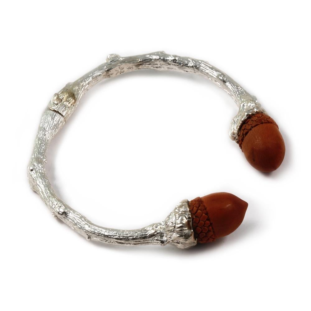 From the K. Brunini Twig Collection, a nature-inspired Cuff in Sterling Silver tipped with Carved Sawo Wood Acorns. 


