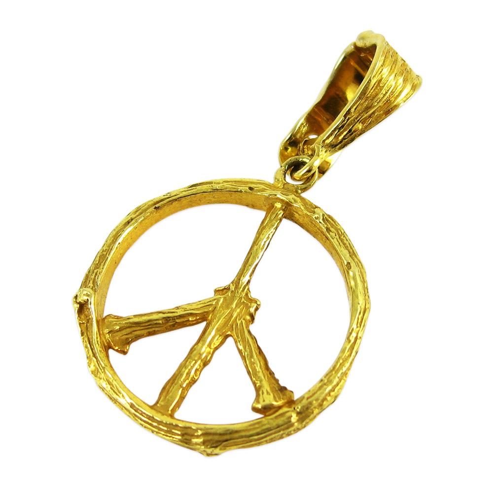 Channeling the eternal Tree of Life, the organic spirit of K. Brunini is captured through this peace sign pendant in 18k yellow gold.

In the Twig Collection, nature exists alongside elegant luxuries, but the lines blur: Rough textures of twigs