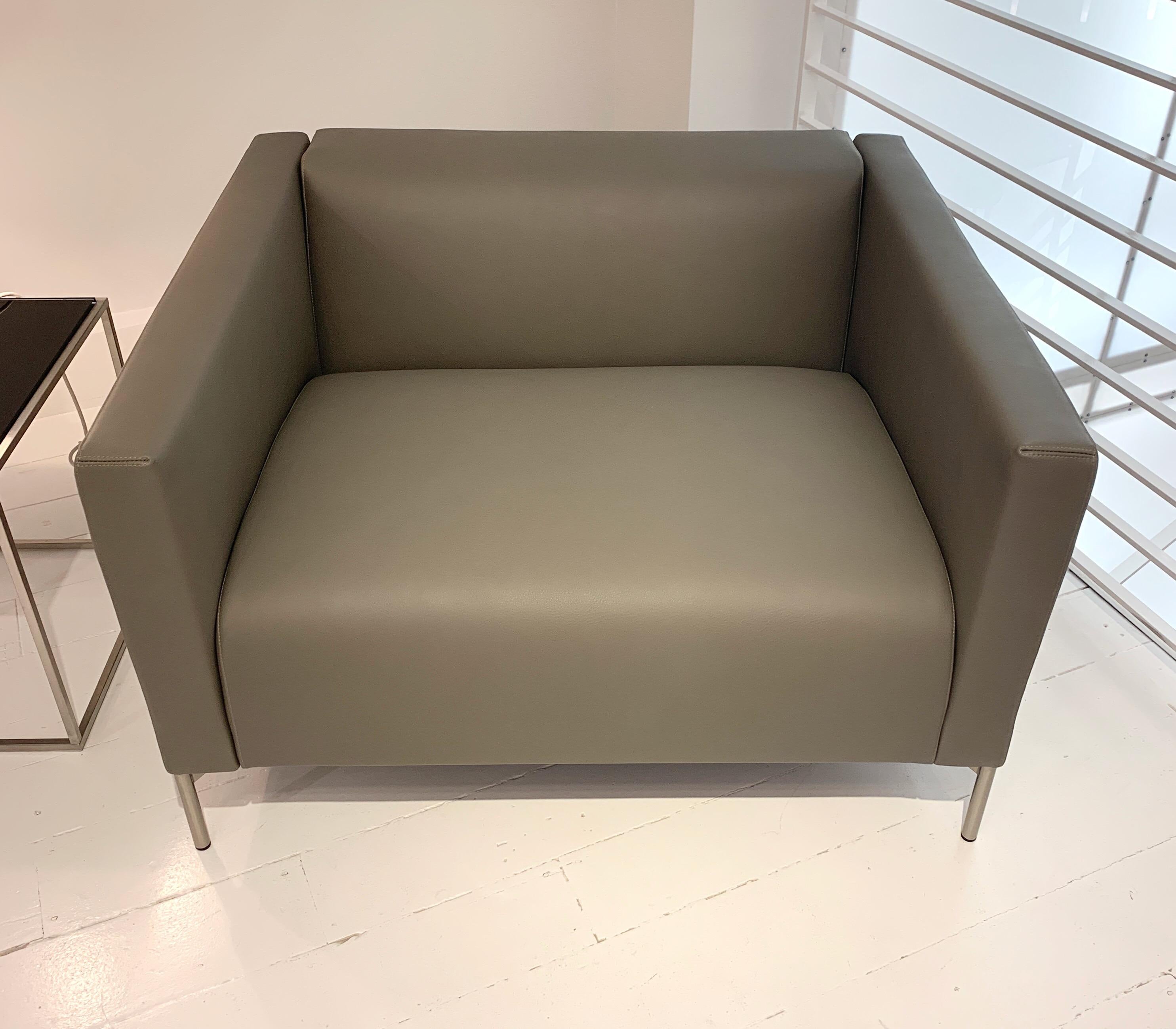 Designed by Piero Lissoni in 2001, this Twin armchair was made in 2018 in gray leather. Like-new condition.