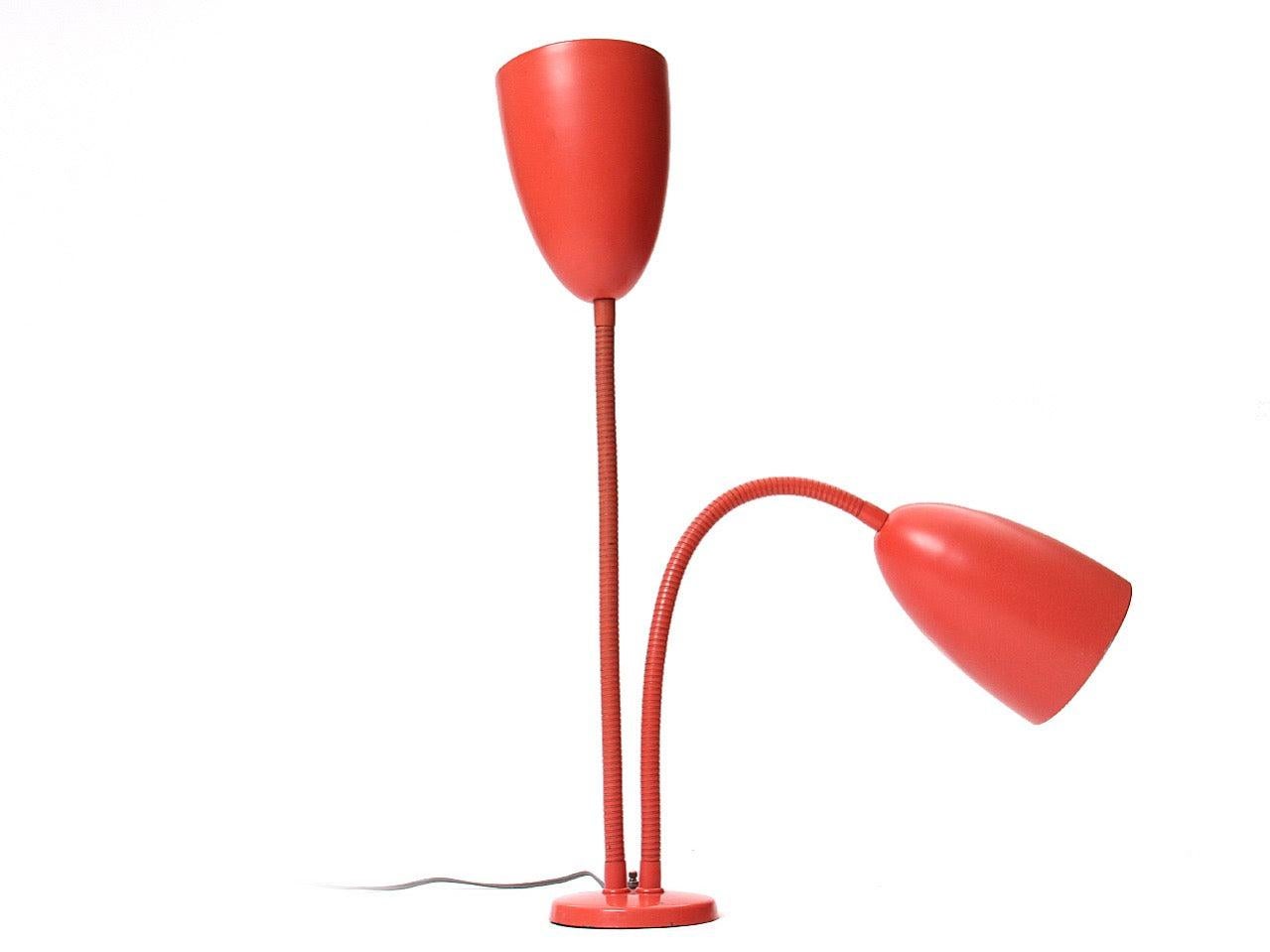 A steel desk lamp with two (2) articulating steel gooseneck arms in the original salmon color.