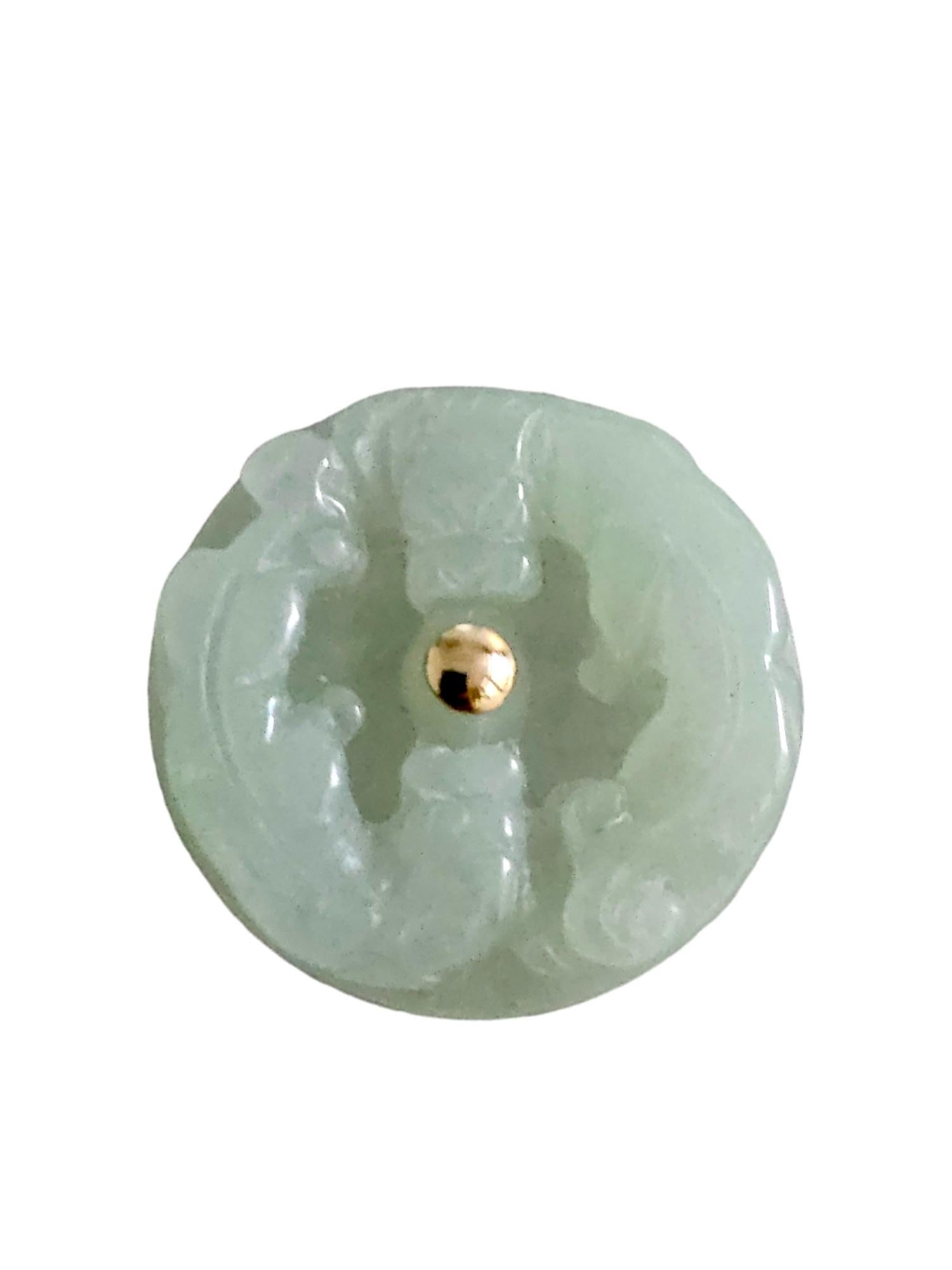 Twin Dragons Burmese Green Jade A-Jadeite Brooch/Lapel Pin with 14K Yellow Gold and Silver 925 Back

Using Handpicked and carved Burmese A-Jadeite. We carved our two dragons that face opposing directions, yet converge onto the center point. We