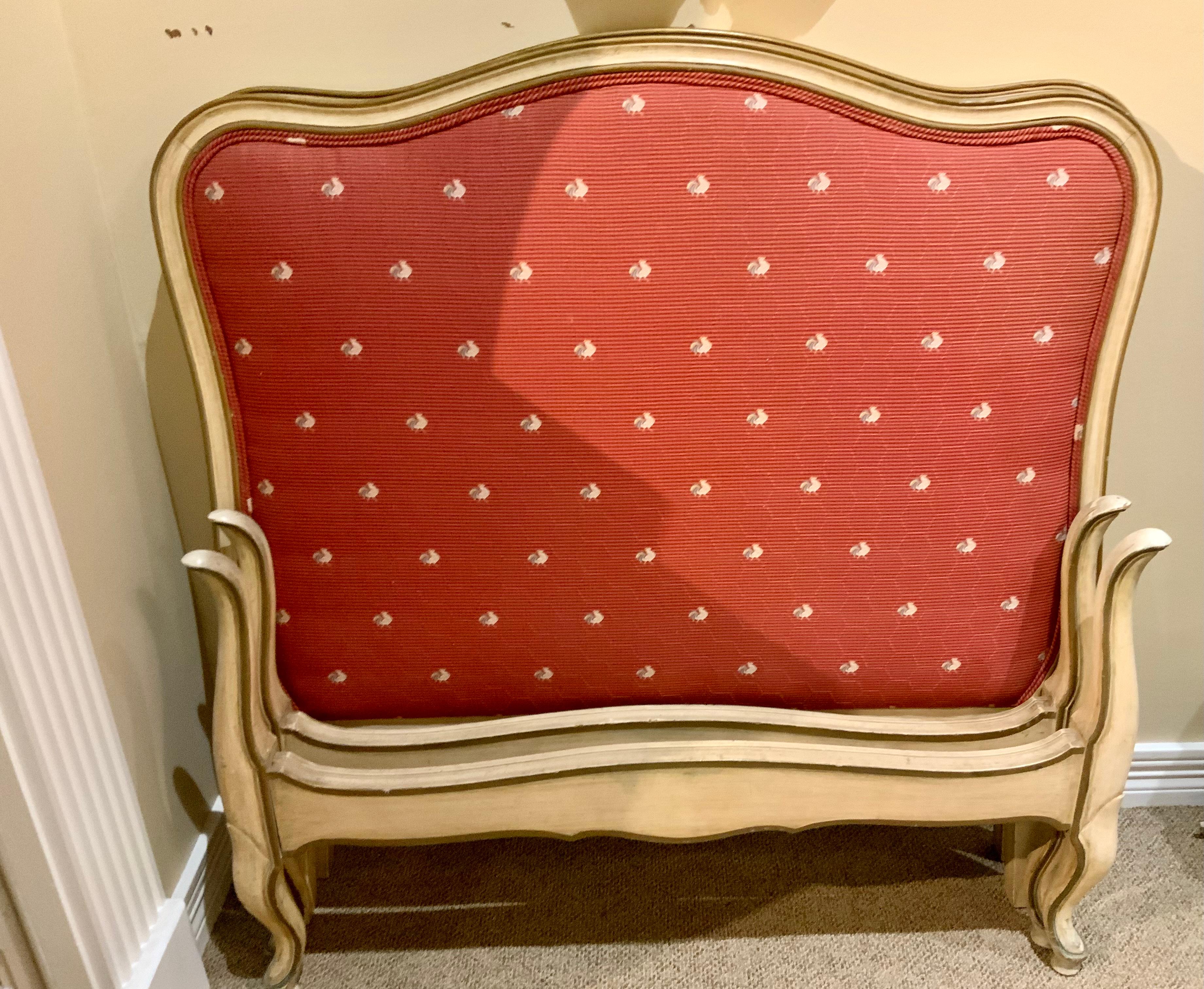Handsome pair of French twin beds that are complete with
Headboards, footboards and side rails. They are upholstered 
In a red fabric with French roosters. They are sturdy and fit
A standard twin mattress. Easy to re upholster