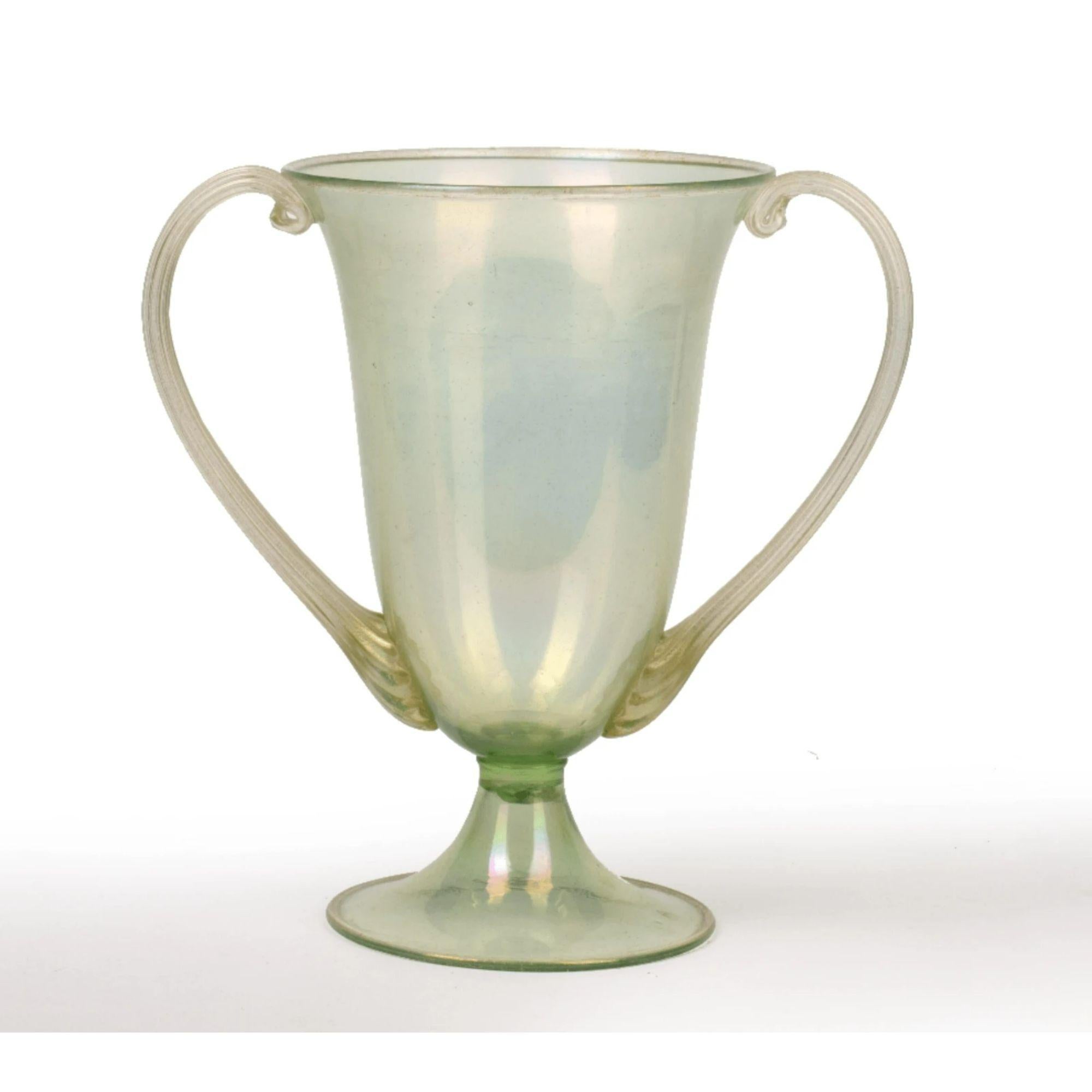 Twin-Handled vase by Salviati & Co.

Venetian twin handled glass vase. Green with gold leaf, unsigned.

Dimensions: H 26cm.