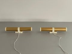 Pareja de apliques de metal dorado con dos cabezas de ERCO, años 70, Alemania