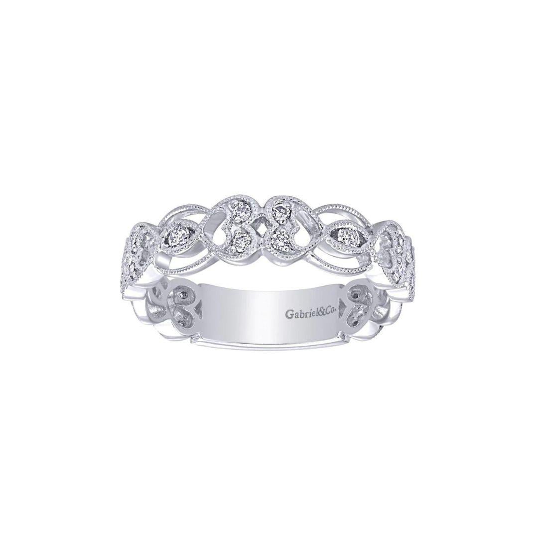 Romantic heart design with pave diamonds and open space give this diamond band a feminine, lacey look. Band contains 0.45 ctw of fine white round diamonds, H color, SI clarity. Band is suitable as a fashion ring, anniversary ring, a wedding band or