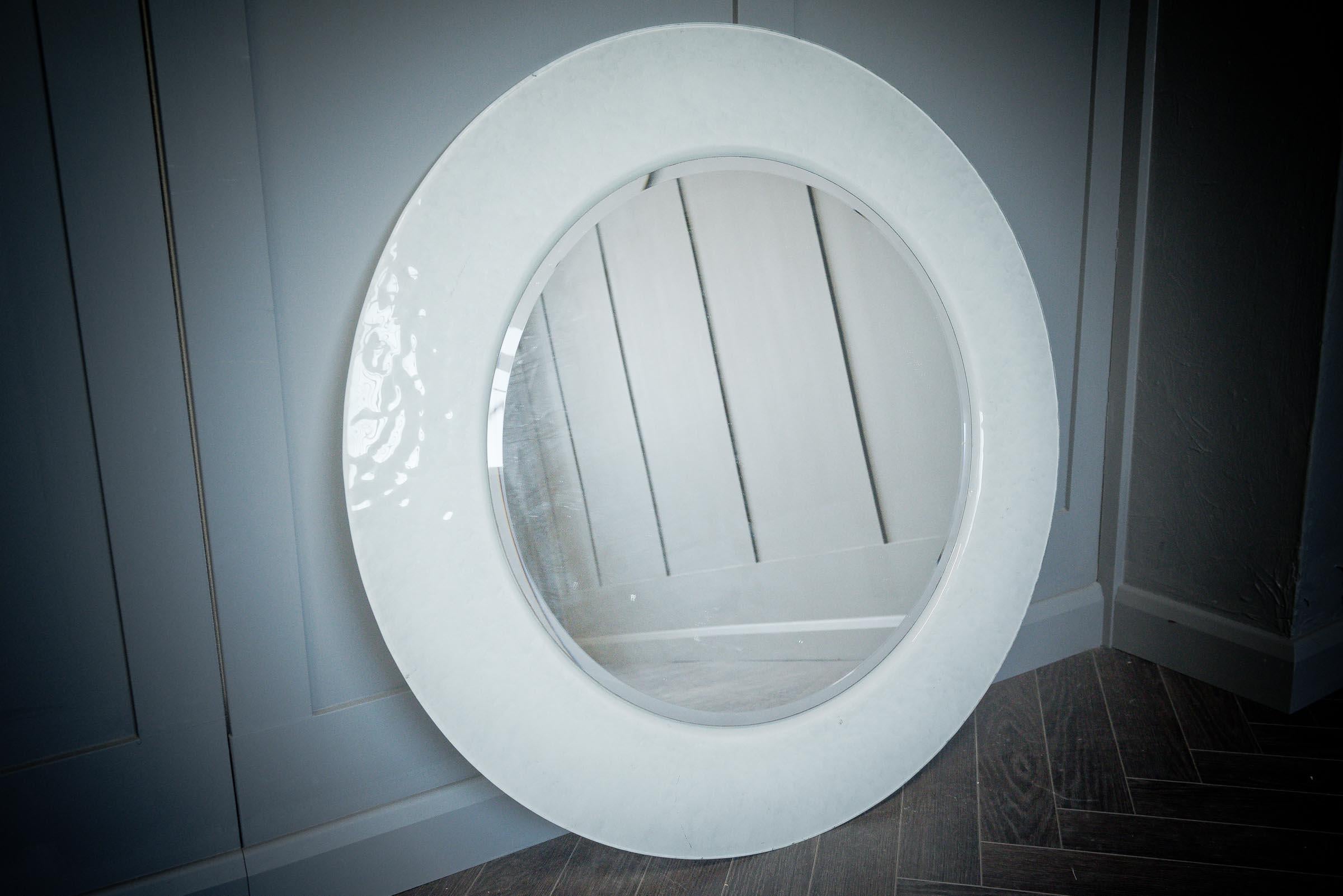 A modern, whitehall mirrors Ltd, elegant twin layer bevel edge circular mirror that oozes elegance with its glass and chrome frame.