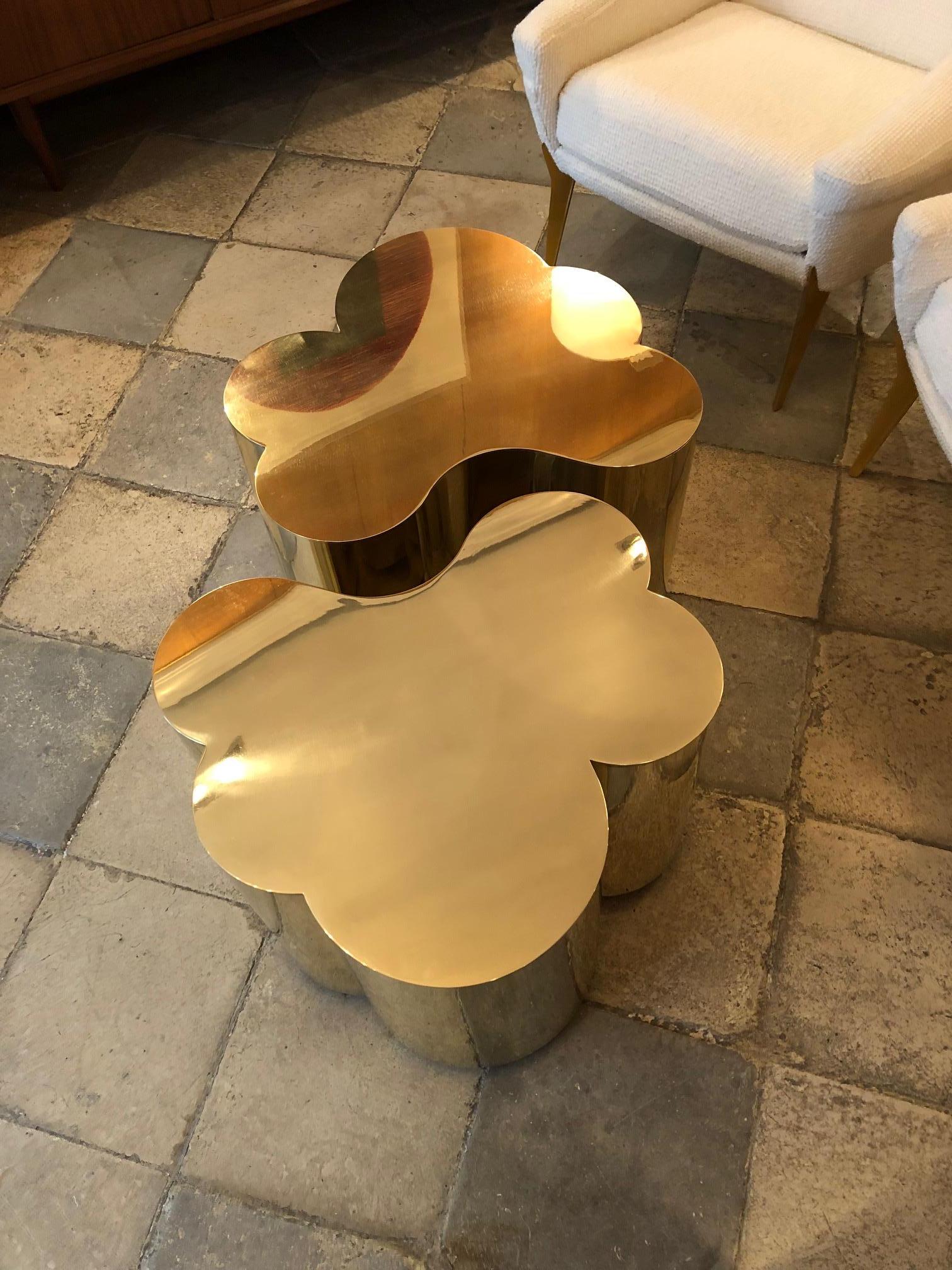 Two tables in brass designed by Edouard De La Marque. They can fit together forming a large coffee table or on each side as end tables. Dimensions indicated below are per table (as shown on the main picture, overall dimensions are: L 108, D 78 cm