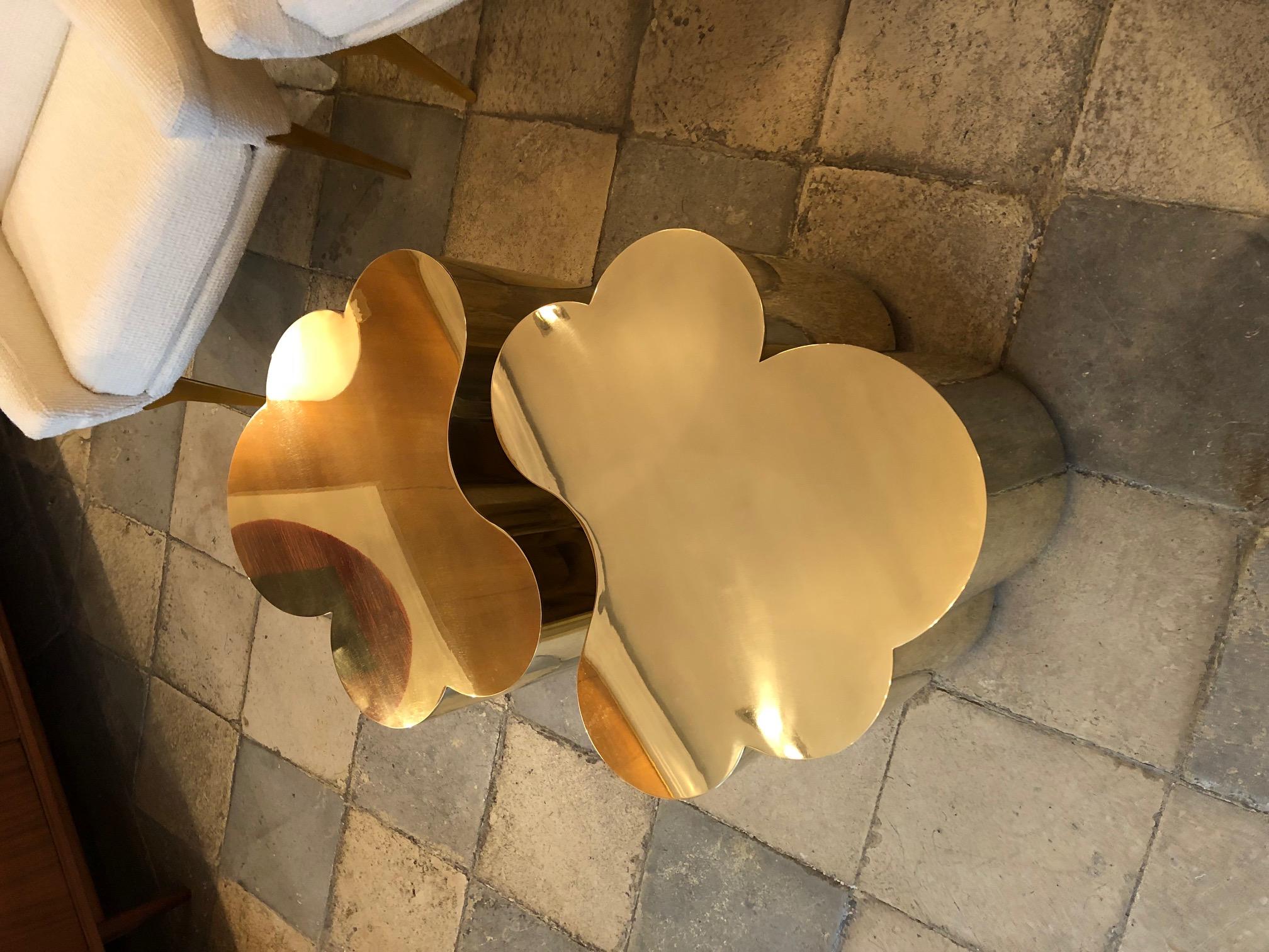 Two coffee tables in brass designed by Edouard De La Marque. They can fit together forming a large coffee table or on each side as end tables. Dimensions indicated below are per table (as shown on the main picture, overall dimensions are: L 108, D