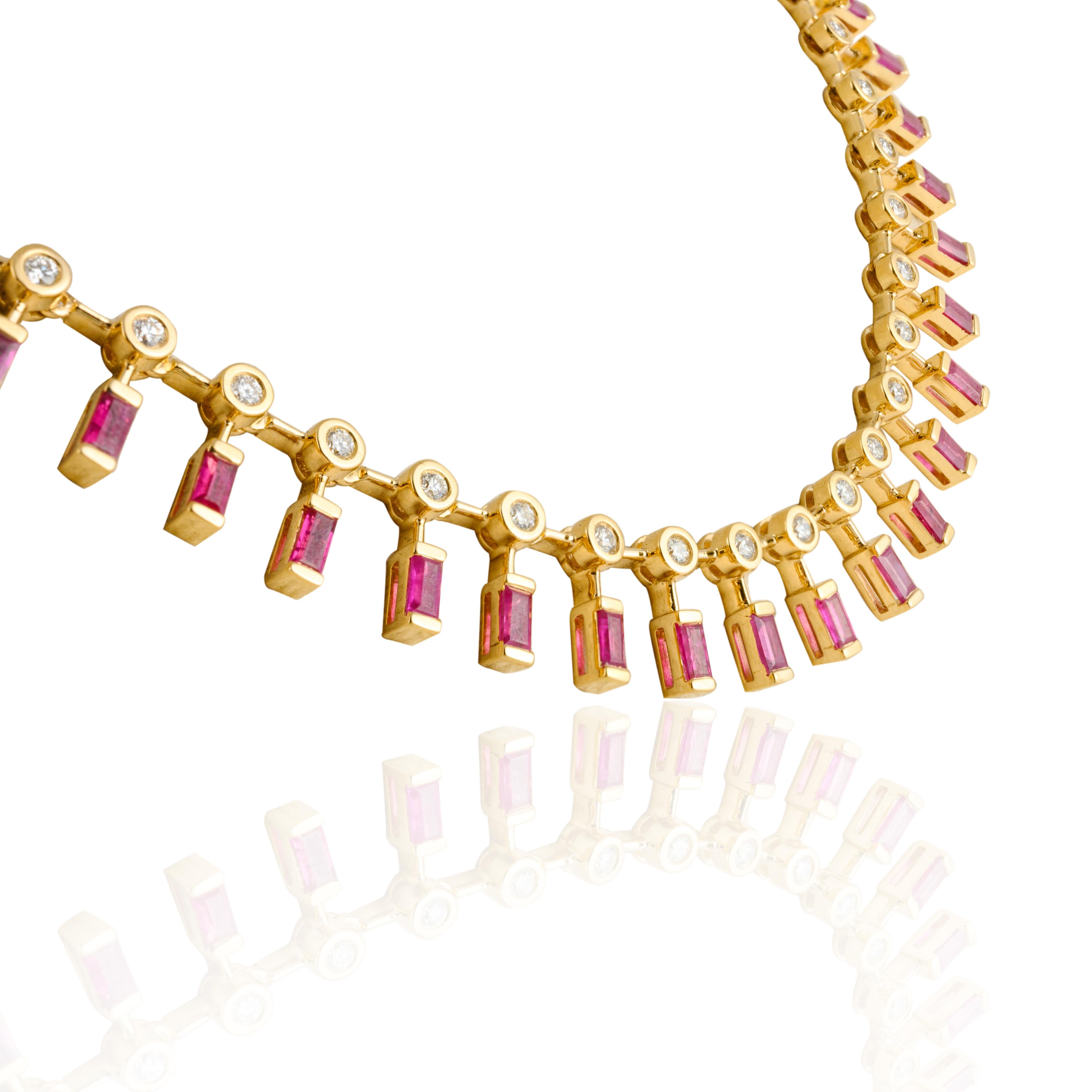 Ruby Diamond Chain Necklace in 18K Gold studded with baguette cut rubies. This stunning piece of jewelry instantly elevates a casual look or dressy outfit. 
Ruby improves mental strength. 
Designed with baguette cut ruby dangling under the diamonds