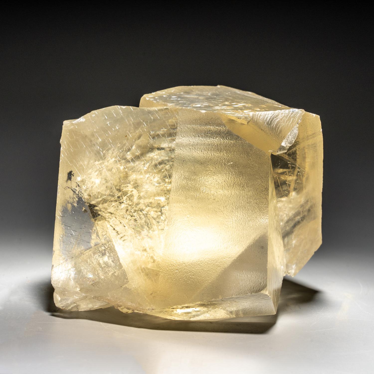 From Nasik District, Maharashtra, India

Penetrating twinned crystals of transparent golden yellow calcite with silky luster faces and sharp terminations. The twin orientation is well defined and visible throught the termination faces.

 2 lbs, 5 x