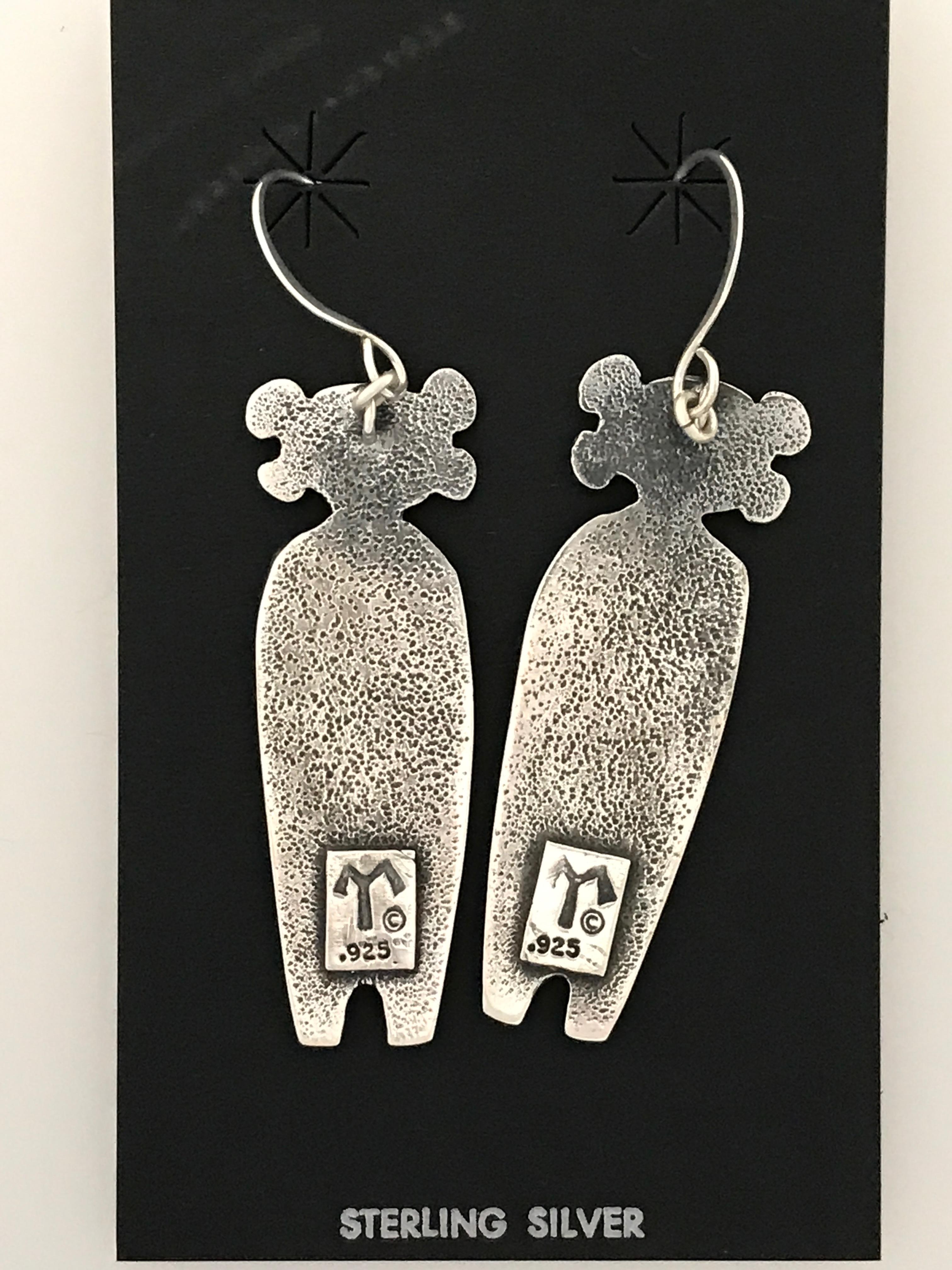 Twins Standing Guard, cast silver earrings Melanie Yazzie Navajo Hopi

Melanie A. Yazzie (Navajo-Diné) is a highly regarded multimedia artist known for her printmaking, paintings, sculpture, and jewelry designs.  

She has exhibited, lectured, and