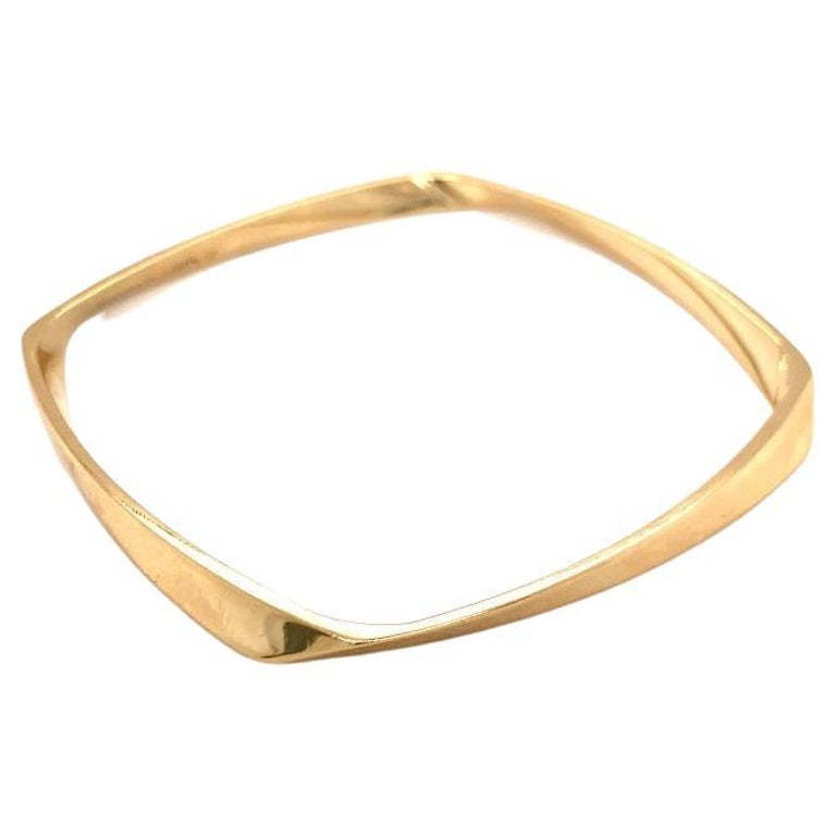 Twist 18k Yellow Gold Torque Bangle by Tiffany and Co., circa 2000s For