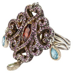 Twist and Turn Silver Ring featuring Pavé Rhodolite