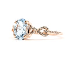 Anello Twist con acquamarina e diamanti in oro rosa 14k