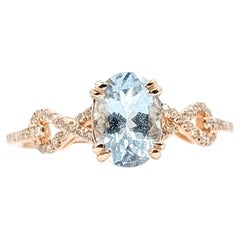 Anello Twist con acquamarina e diamanti in oro rosa 14k
