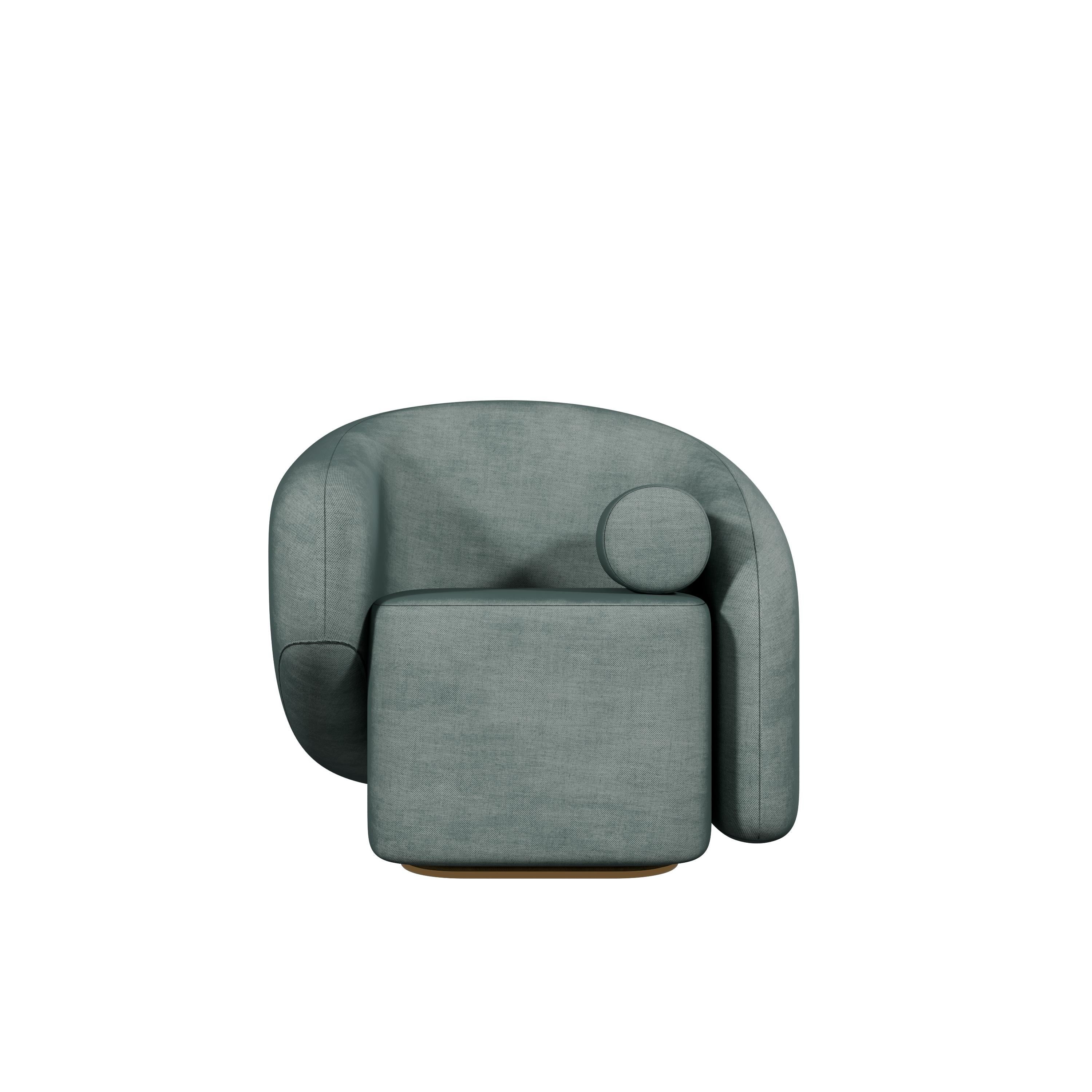 The Twist armchair, a masterpiece from Murmurio, is a bold statement piece that redefines contemporary design. Entirely upholstered and perched on a golden plinth, it exudes a sense of luxury and elegance. Its most striking feature is the