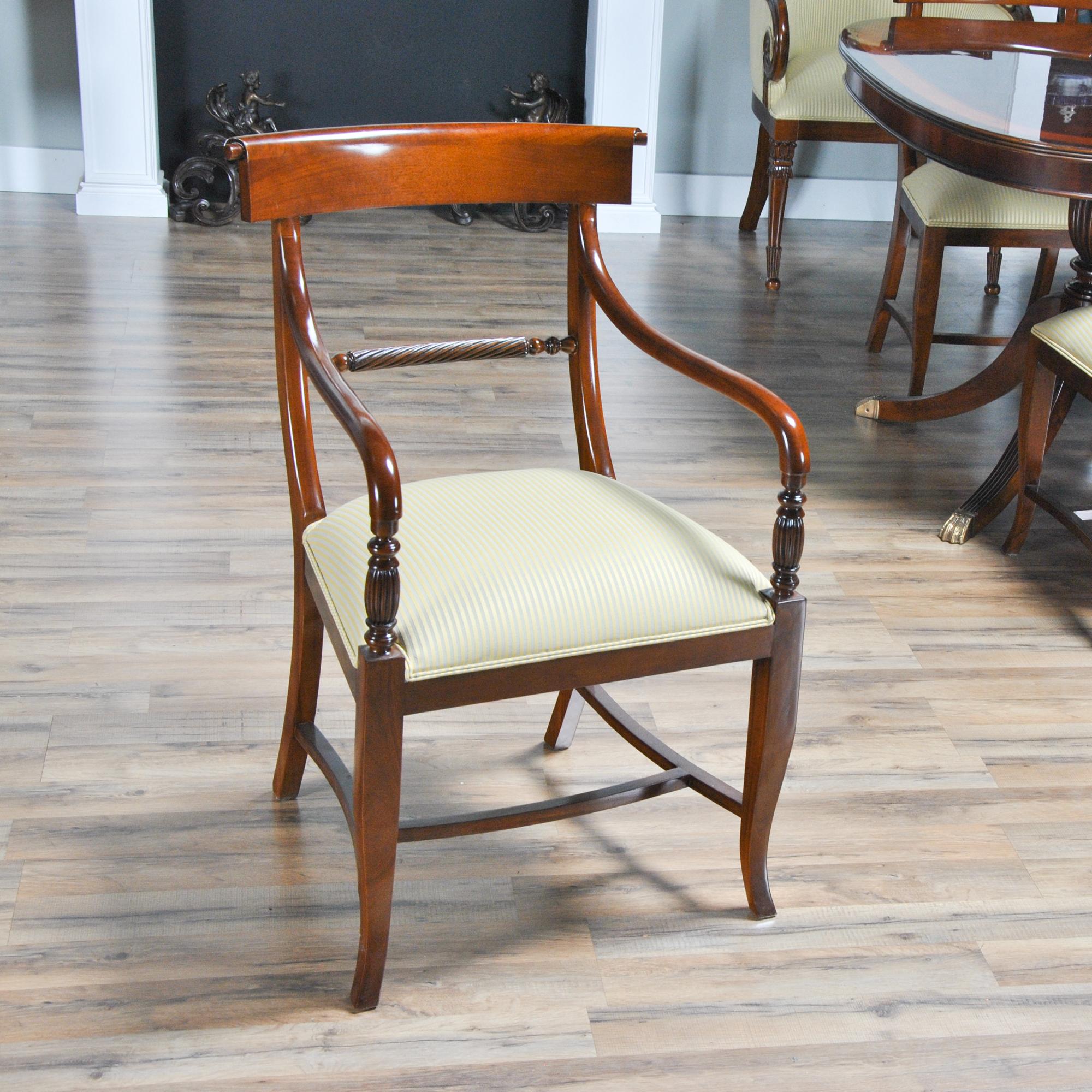The set of 10 Federal Style, Twist Back chairs are comprised of 2 arm chairs and 8 side chairs. All of the Twist Back Chairs are hand carved from great quality, plantation grown, solid mahogany. The bowed crest rail features turned carvings, the