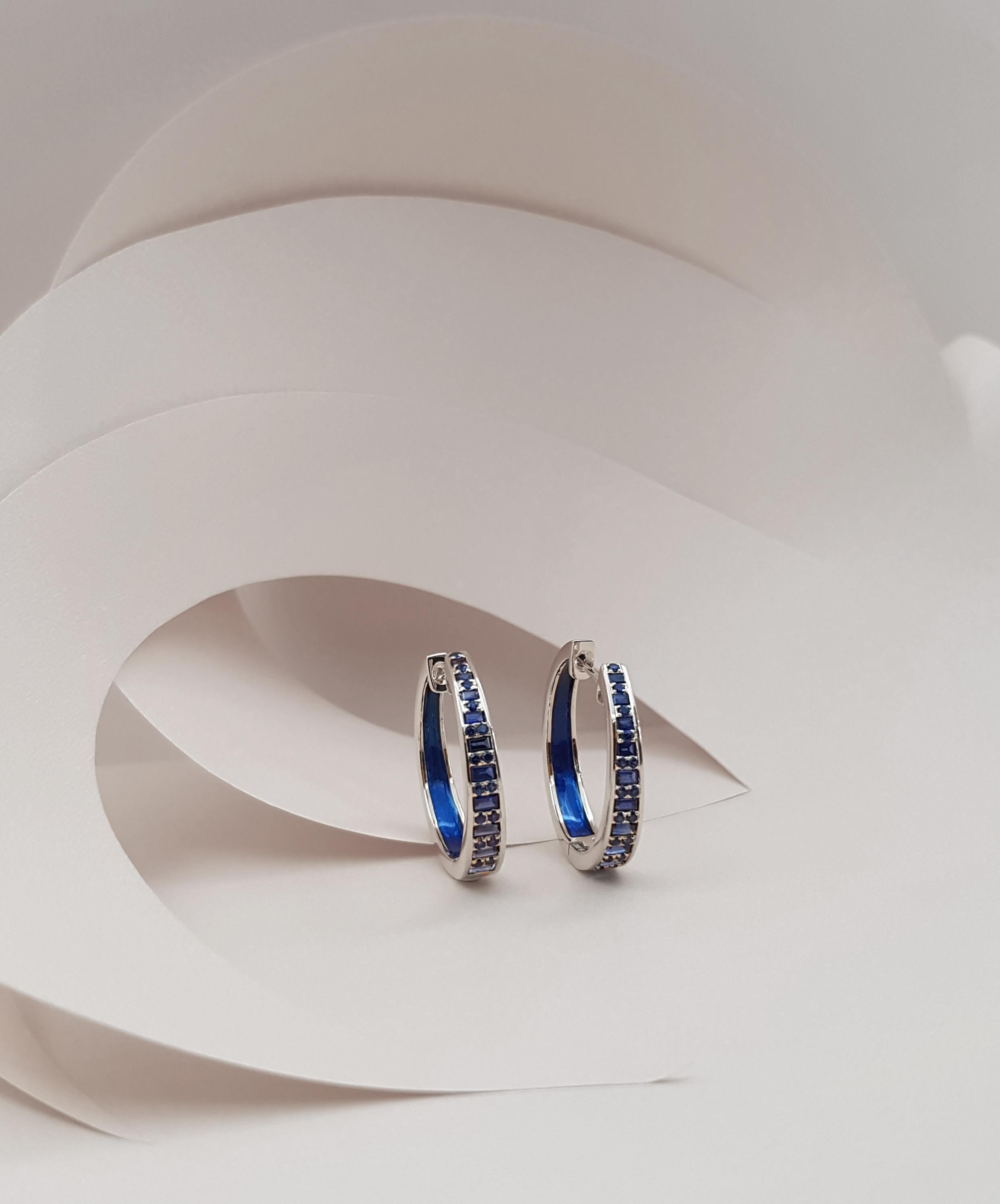 Twist Blue Sapphire 2.04 carats with Enamel Hoop Earrings 18K White Gold 

Width:  0.4 cm
Diameter:  2.3 cm


The TWIST Reflection is inspired by several abstract artist and heavily by Hilma Af Klint's works. The creative forces behind Kavant &