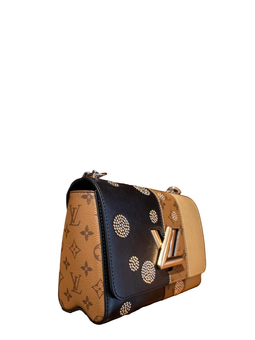 Louis Vuitton cruise collection Twist bag with silver and gold LV twist lock, silver and gold dot studs, and silver chain strap. Absolutely clean inside, with slight signs of use, as you can see in the pictures.

Comes with a dustbag
Very Good