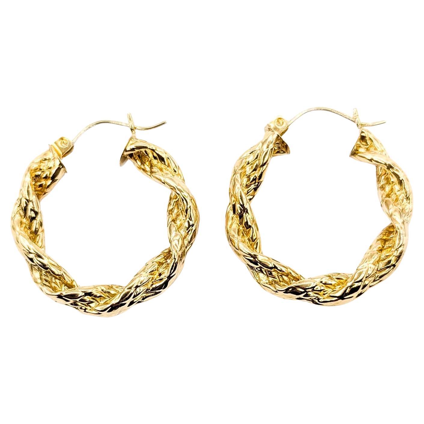 Orecchini a cerchio Twist in oro giallo 14 carati