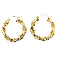 Orecchini a cerchio Twist in oro giallo 14 carati