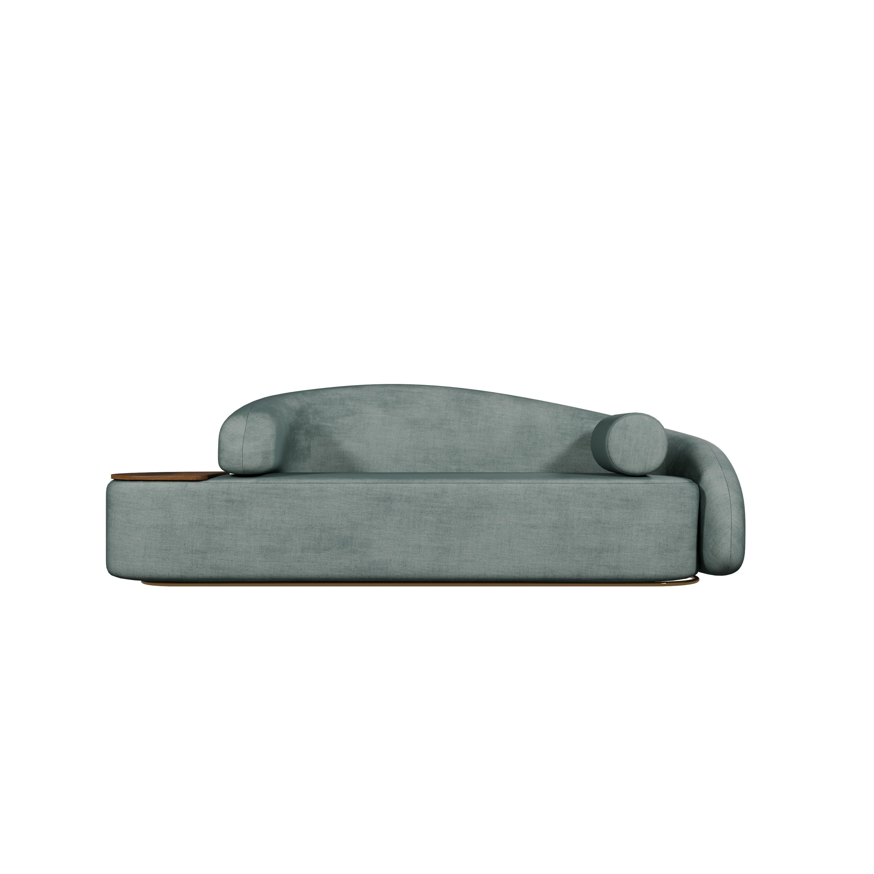 The Twist sofa, a masterpiece from Murmurio, is a bold statement piece that redefines contemporary design. Entirely upholstered and perched on a golden plinth, it exudes luxury and elegance. Its most striking feature is the asymmetrical armrests,