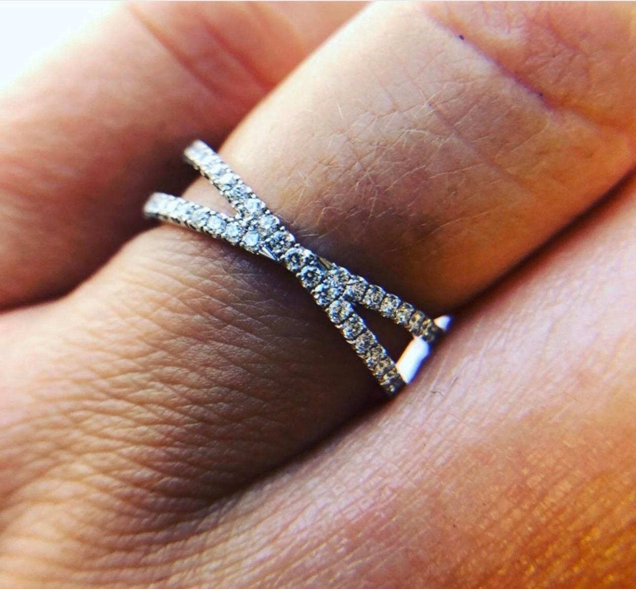 Classical wedding ring with a twist made in 18KT white gold with fine diamonds, VS clarity, F color and Excellent cut totaling 0.55 carats in size 6. Ring can be re-sized please add your size at check out. 

Certificate of authenticity comes with