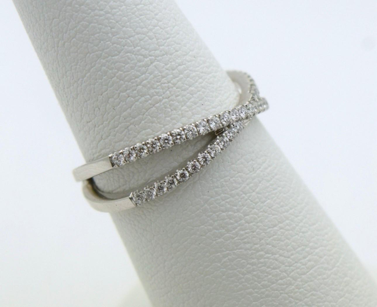 Brilliant Cut Twist wedding band 18KT gold 0.55ct natural diamonds VS clarity F color size 6 For Sale