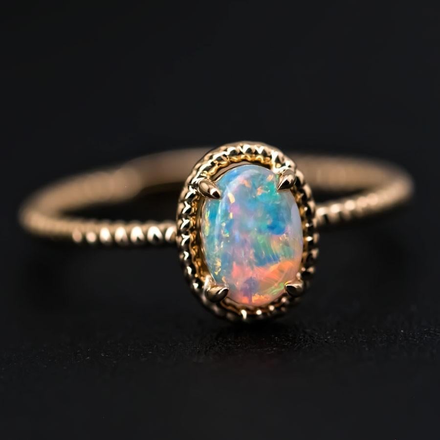 Twisted Band Oval Australian Solid Opal Ring in 14K Yellow Gold.


Free Domestic USPS First Class Shipping!  Free One Year Limited Warranty!  Free Gift Bag or Box with every order!



Opal—the queen of gemstones, is one of the most beautiful and