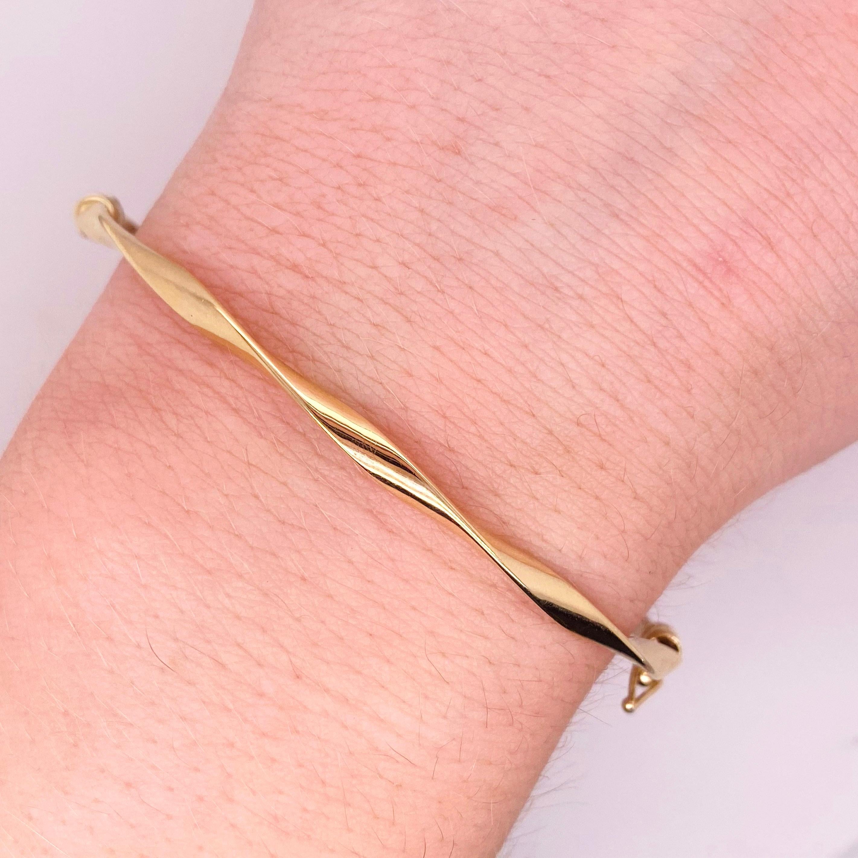 The twisted bangle bracelet is amazing! The details for this gorgeous bracelet are listed below:
Bracelet Type: Bangle with Safety Latch
Metal Quality: 14 Karat Yellow Gold
Circumference: 7.5 inches
Diameter: 2.25 x 2.5 inches
Width: 2.7