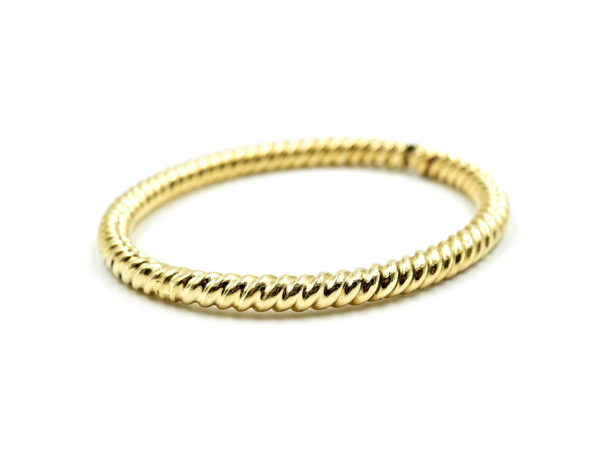 Designer: custom design
Material: 14k yellow gold
Dimensions: bangle will fit 7-inch wrist and the bangle is 1/4 inches wide
Weight: 17.58 grams
