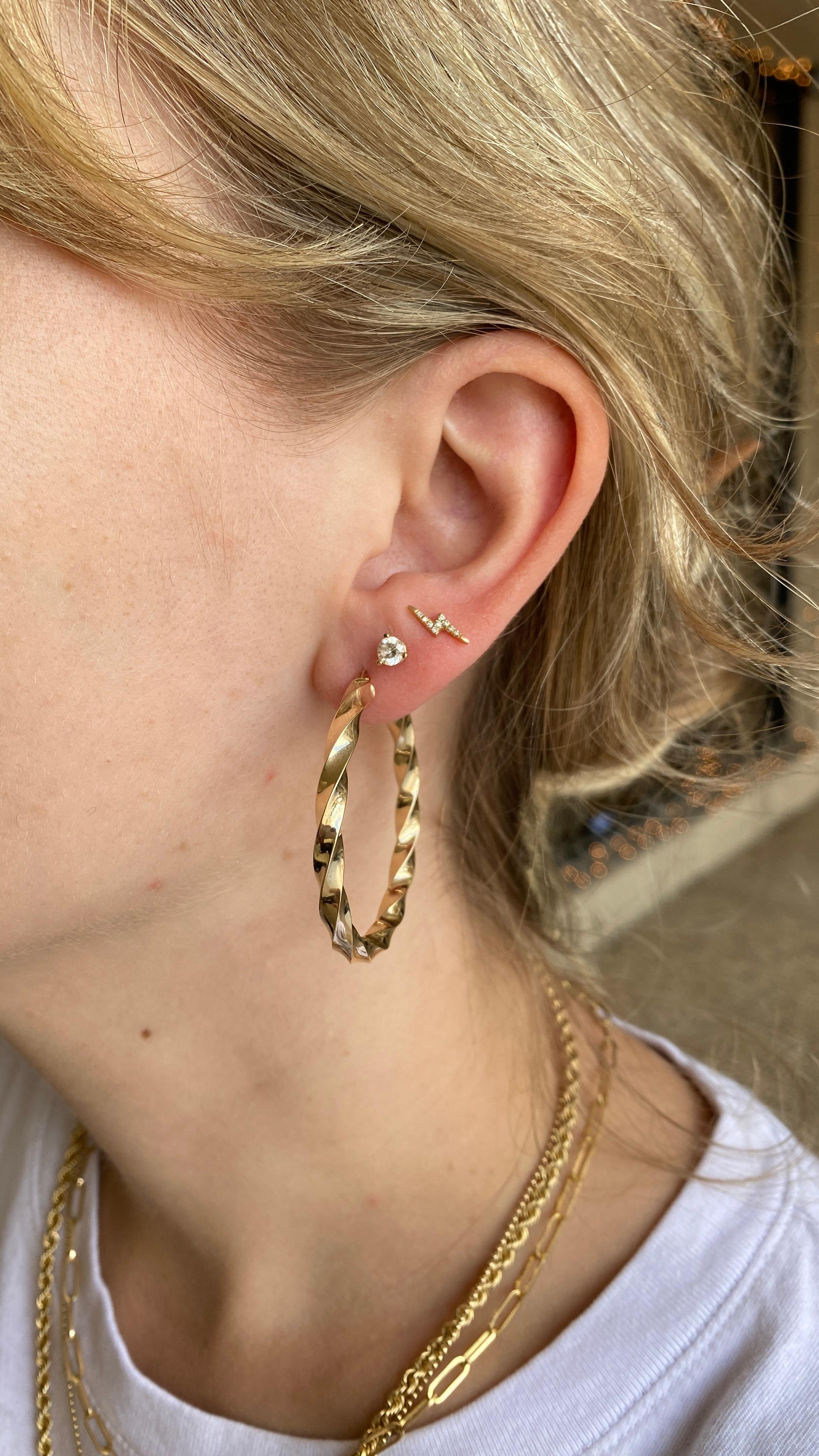 Gold hoops are a jewelry staple! These hoop earrings are the perfect addition to any fine jewelry collection. With a classic design and unique twist texture and high polish hoops are so versatile! Wear them everyday, casually or save them for a