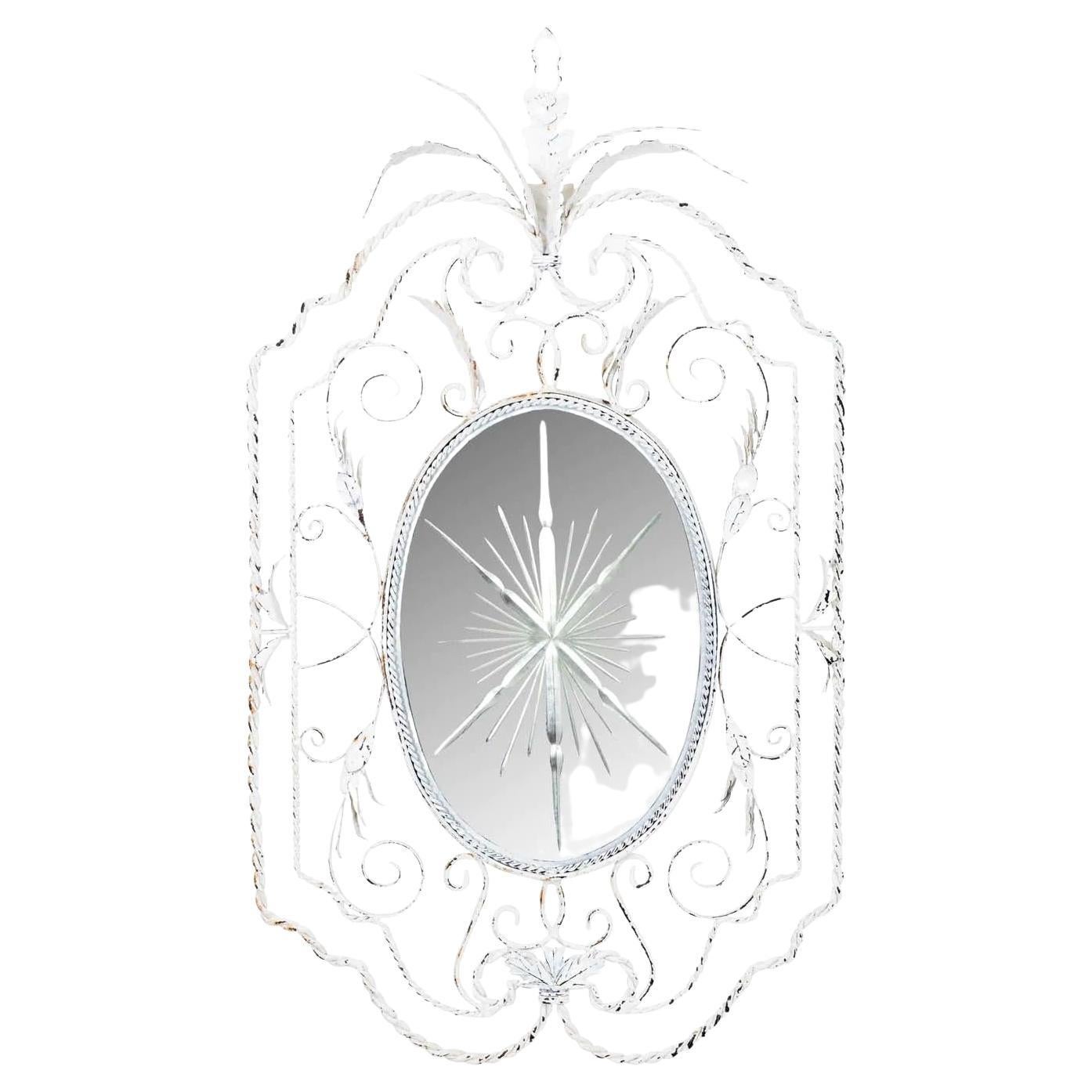 Painted twisted iron framed mirror with distressed starburst in mirror. Original shabby chic distressed white painted finish. Overall good condition.