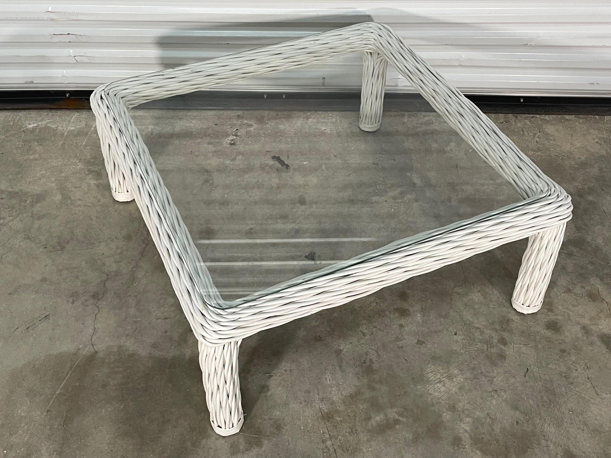 Organic modern coffee table features frame of twisted rattan and glass top. Good condition with imperfections consistent with age, see photos for condition details. We offer professional refinishing services, if interested, send us a message. 
For