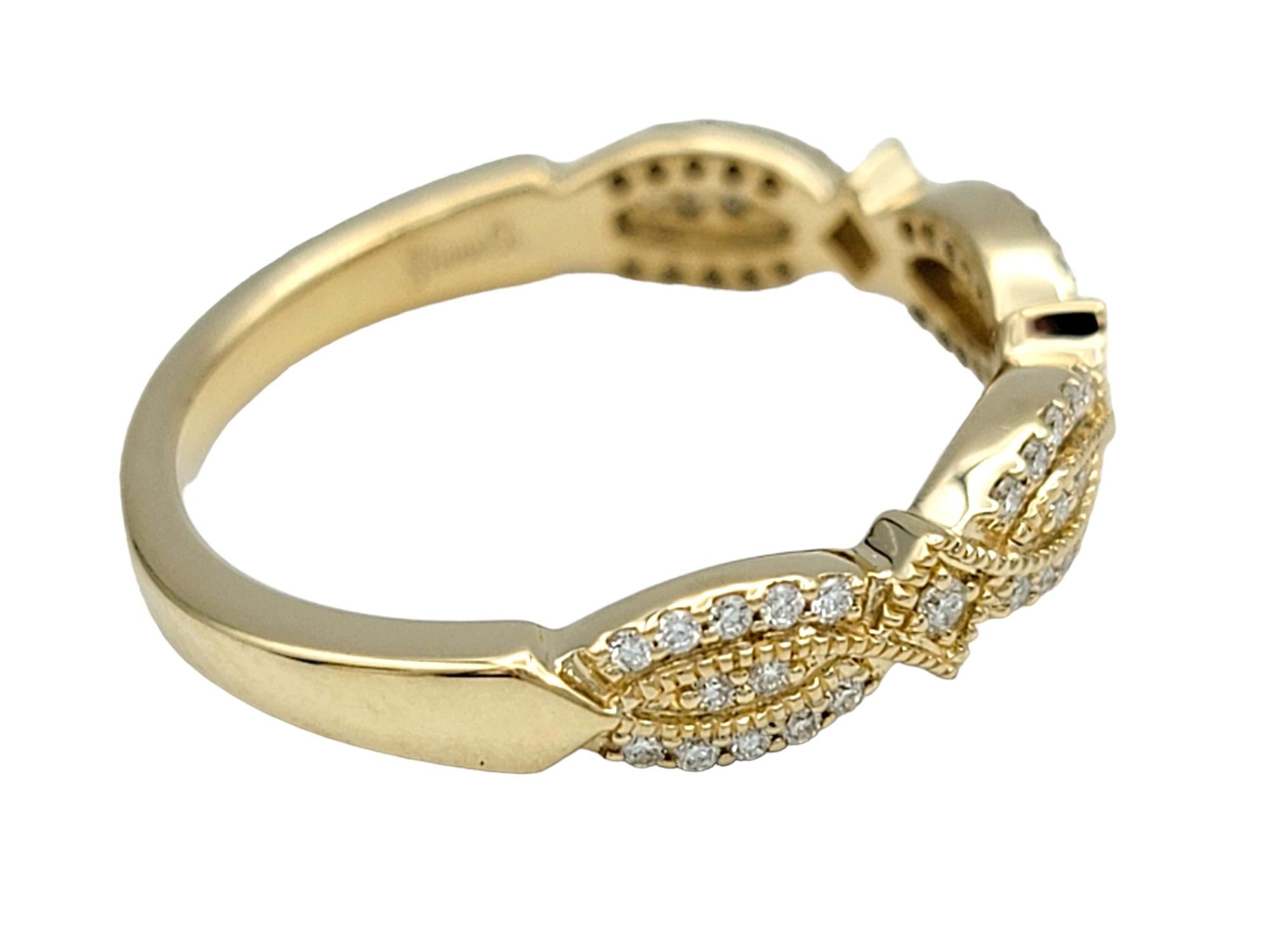Ring Size: 6

This stunning pavé diamond band ring features a twisted design, crafted in luxurious 14 karat yellow gold. The intertwining style creates an intricate and dynamic look, adding a touch of elegance and sophistication to any