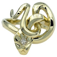 Twisted Snake Ring with Diamond Head and Green Eyes Set in 14 Karat Yellow Gold