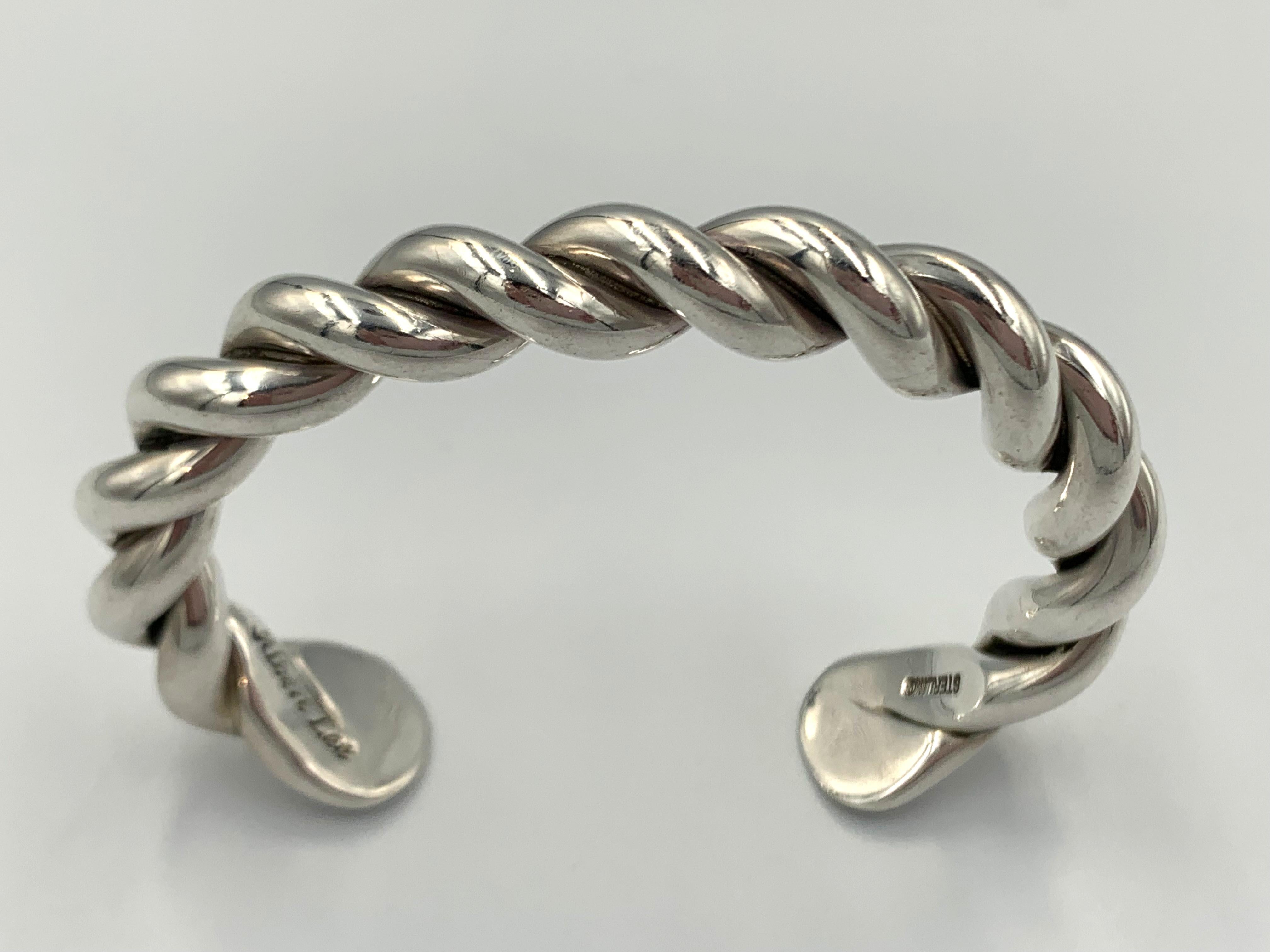 Heavy gauge sterling silver bracelet by Navajo silversmith Albert Lee. The twisted silver cuff is 5 1/4” with a 1 1/8” gap.

Gap: 1-1/8”
Total inside circumference: 6-3/8”

About the Artist

Albert Lee (1980-2022)

Albert & Alfred Lee Jr. are sixth
