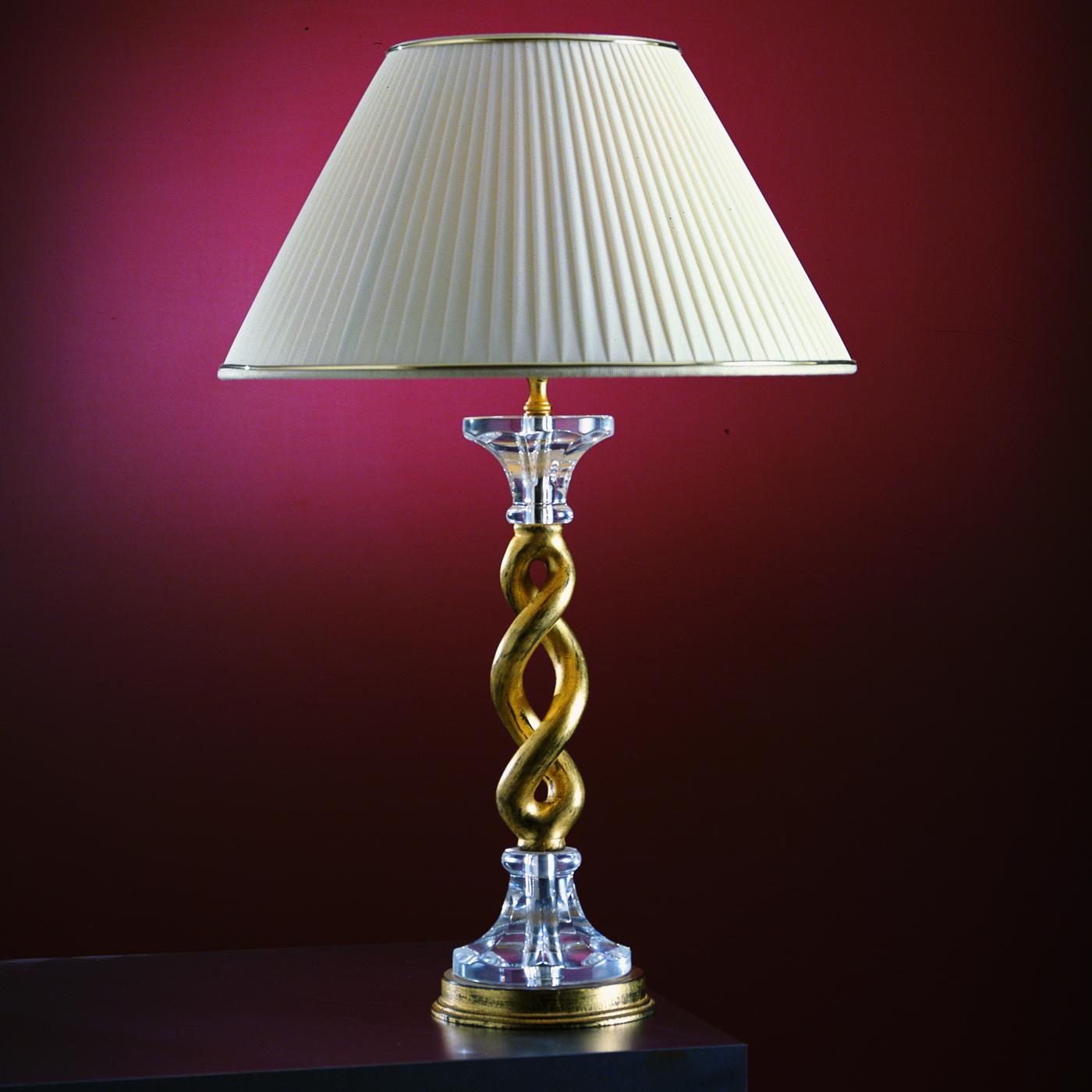 The refined and timeless style of this table lamp will provide a captivating decorative accent while casting a sophisticated ambient light in any midcentury and classic interior. Available also as a floor lamp, the sinuous silhouette fashioned of