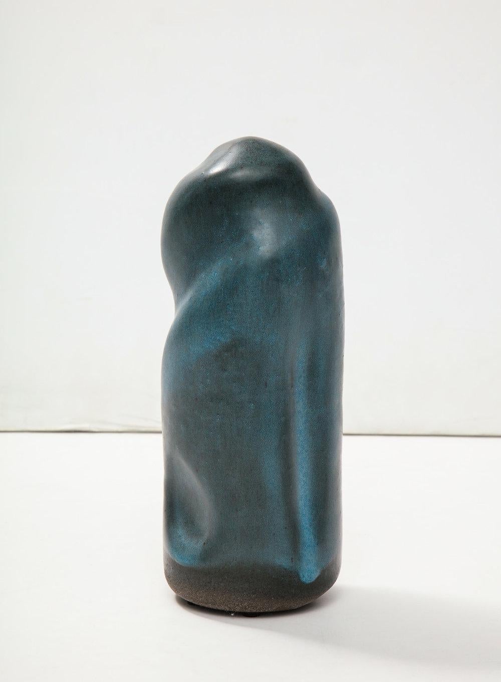 Cylindrical totem-form, wheel thrown, with indented twist details. Teal-blue glaze. Hand-built and artist-signed on underside.