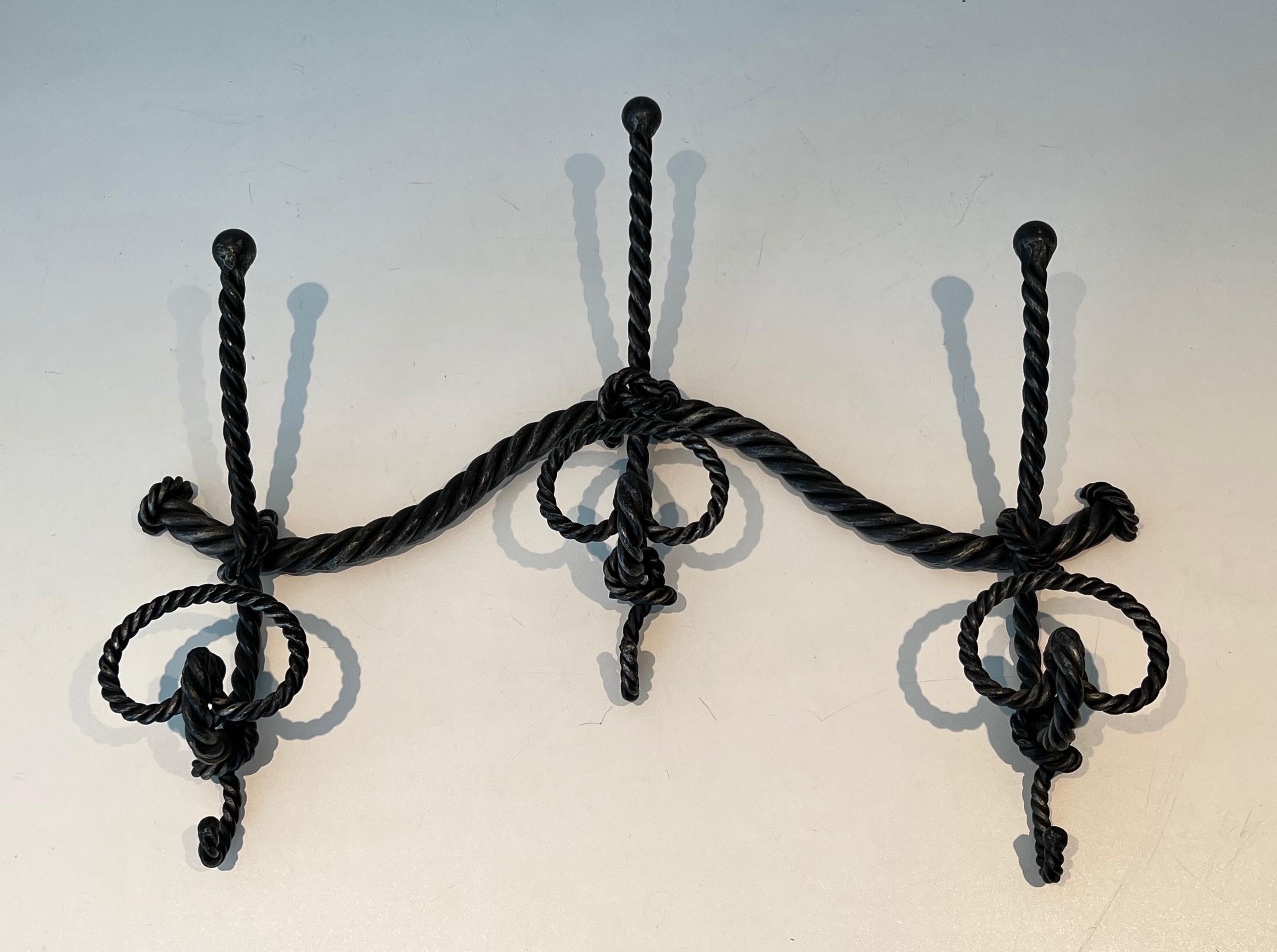 This very nice wisted coat rack is made of wrought iron. This is a very nice and fine iron work. French Work. Circa 1940