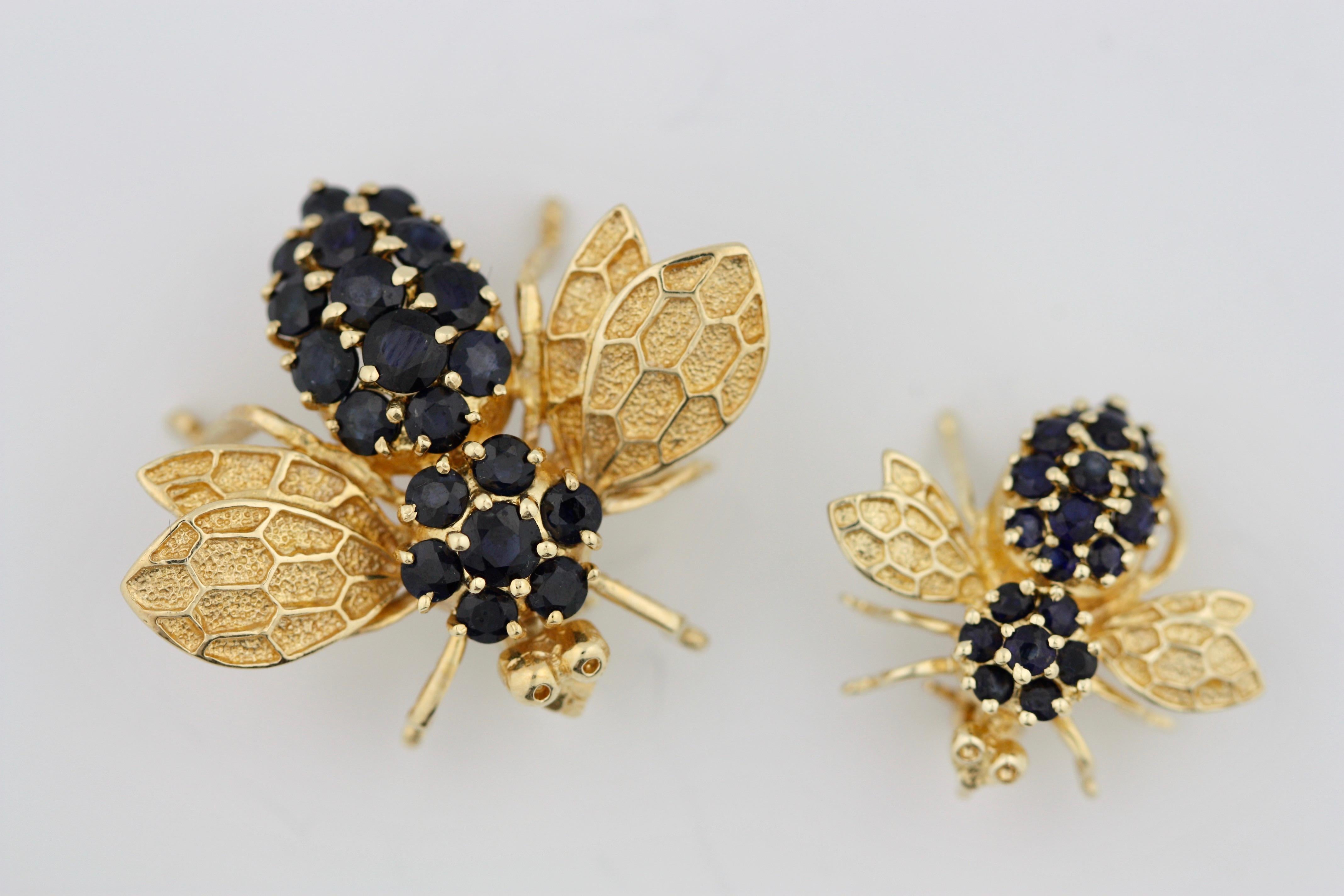 
Two 14 Karat Gold and Gem-Set Bee Brooches, 
designed as bees, set with sapphires weighing approximately 2.00 carats, completed by two round gold eyes, 
mounted in 14kt yellow gold 
14 grams (gross), size 2.5 cm & 2 cm,2 pieces.