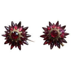 Two 18 Carat gold Garnet Star Brooch