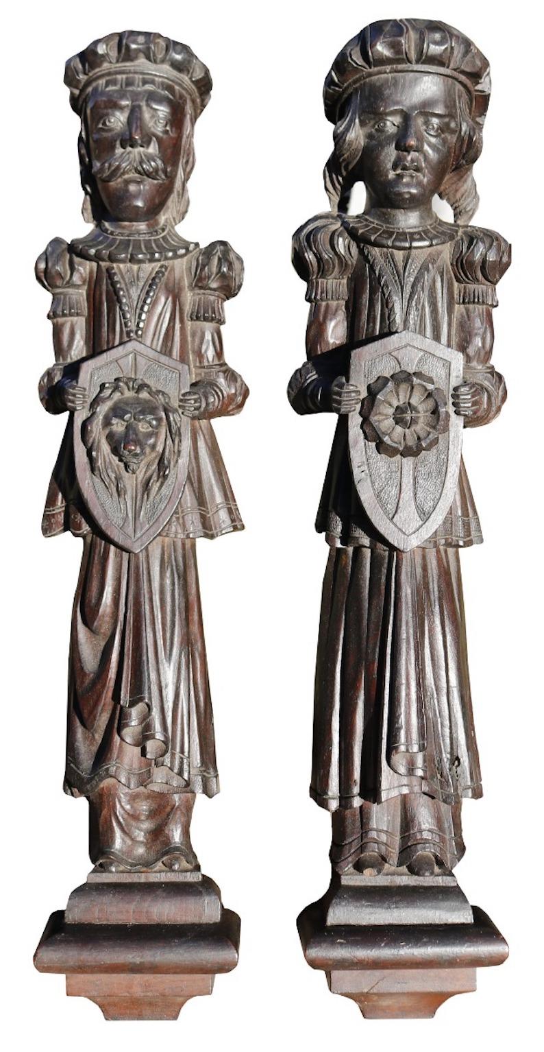 A pair of antique English carved oak figures. These were previously part of a panelled room in a house in Hampshire, constructed from earlier pieces of architectural salvage and assembled in 1890.

Additional Dimensions ( Each )

Height  73