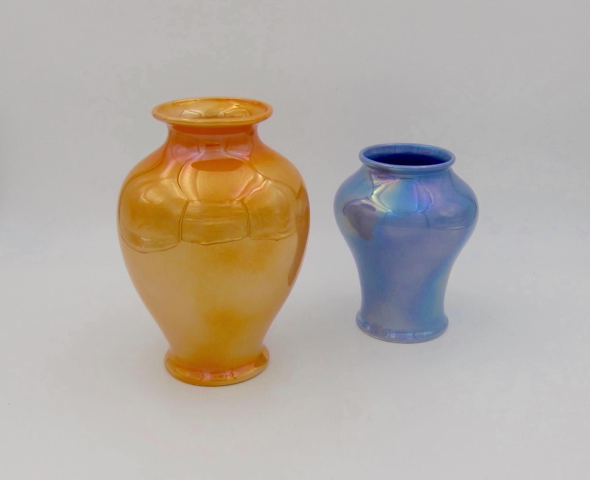 Two American art pottery vases with Marigold and Larkspur reflective luster glazes from Cowan Pottery Studio, dating 1922-1927. Both vases were slip cast and decorated with Cowan's breakthrough development of an iridescent metallic glaze process