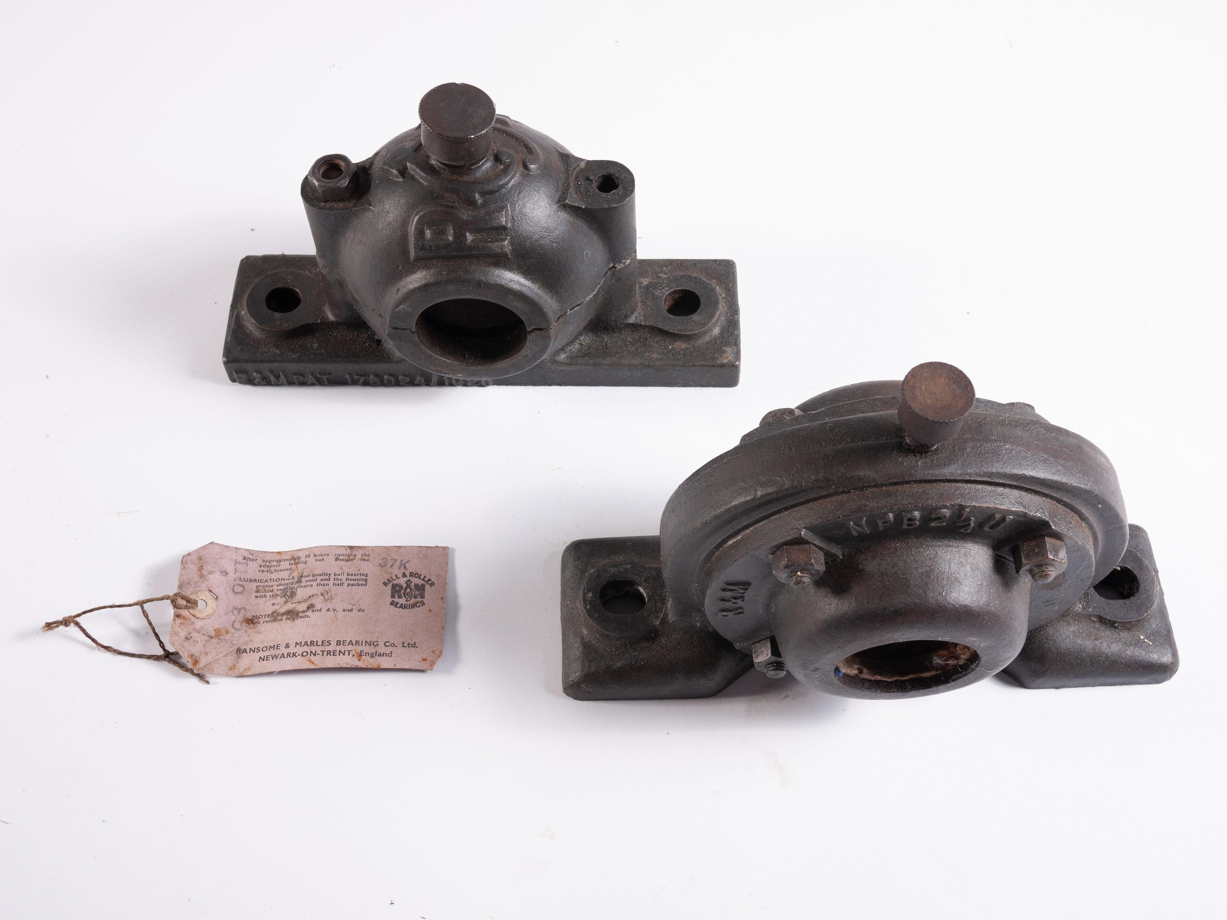 Two 1920s industrial decorative cast metal bearings.
Two vintage 1920s original decorative cast metal bearings. Originally from Crowle brickworks these bearings were used to support the power axles running from the site steam engine. Dated 1920.