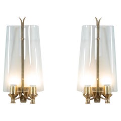 Two 1940s Brass and Curved Glass Wall Sconces by Pietro Chiesa for Fontana Arte