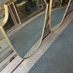 Two 1960s Gio Ponti Style Mid-Century Modern Brass Shield Shaped Italian Mirrors