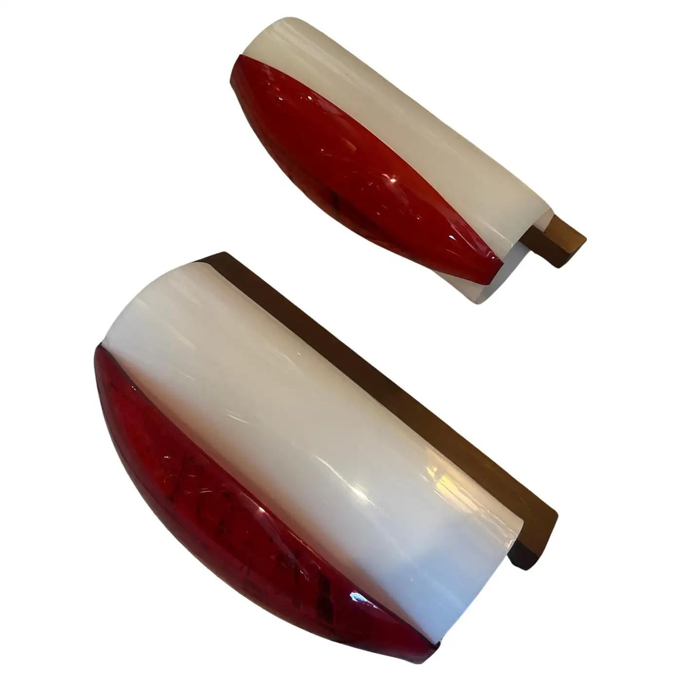 A pair of wall sconces designed and manufactured in Italy in the Sixties by Stilux, they are in perfect condition and in working order.
Mid-Century Modern design, popularized during the 1950s and 1960s, emphasizes clean lines, simplicity, and