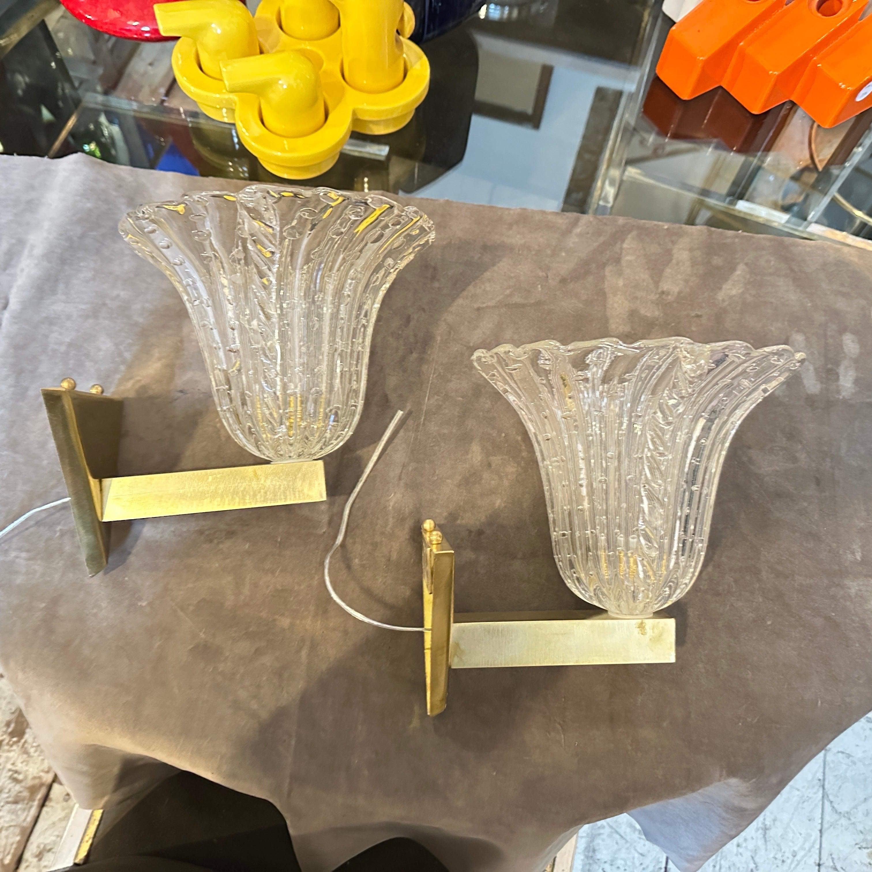These are two stunning Mid-Century Modern wall sconces from the 1970s, designed in the Barovier style. They feature **Bullicante** clear Murano glass shades, which have a unique bubbled texture achieved through a controlled air bubble technique. The